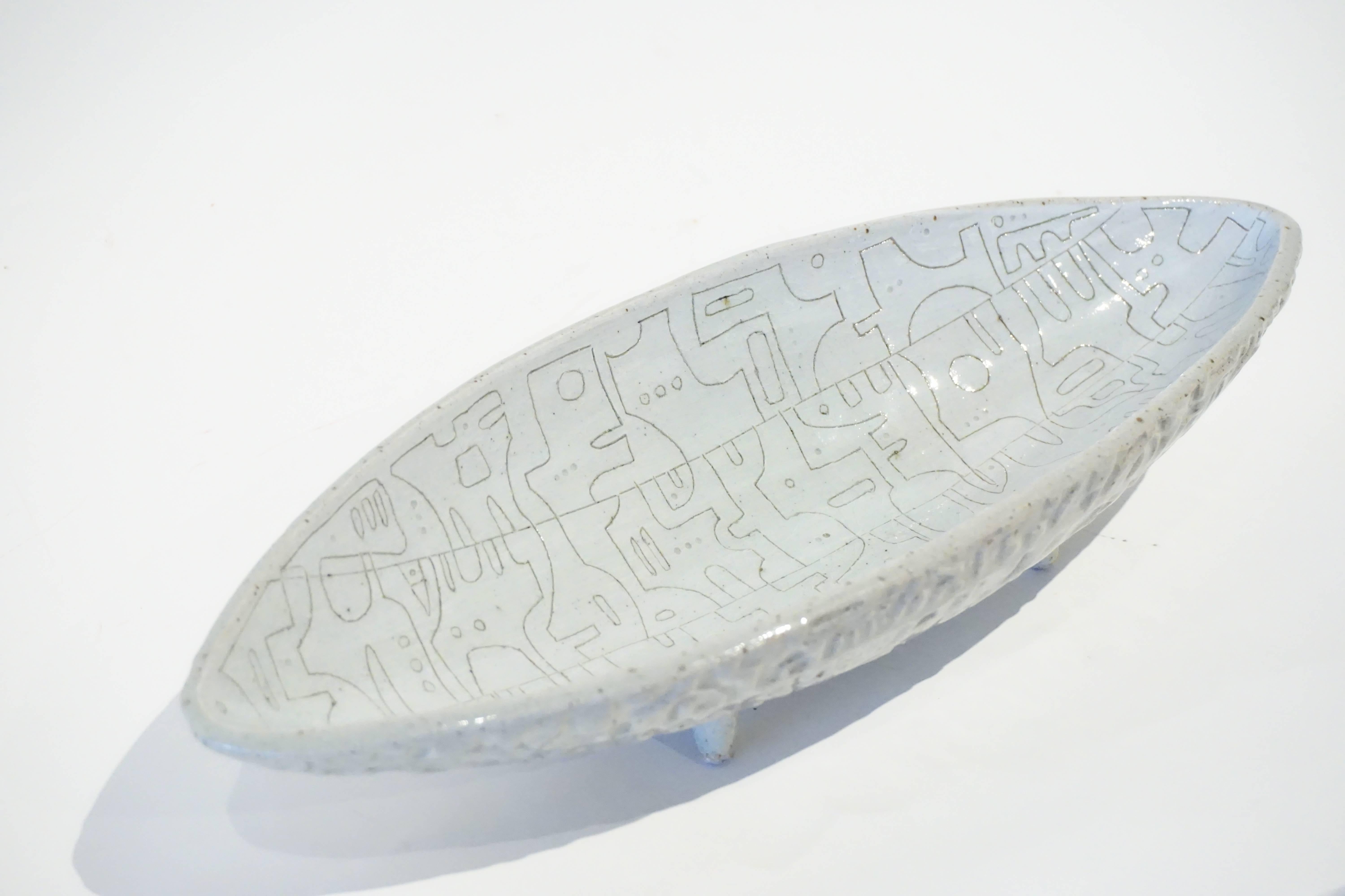 A pale gray scribed & embossed footed ceramic oblong bowl by studio potter Heather Rosenman, 2016.  HR2048