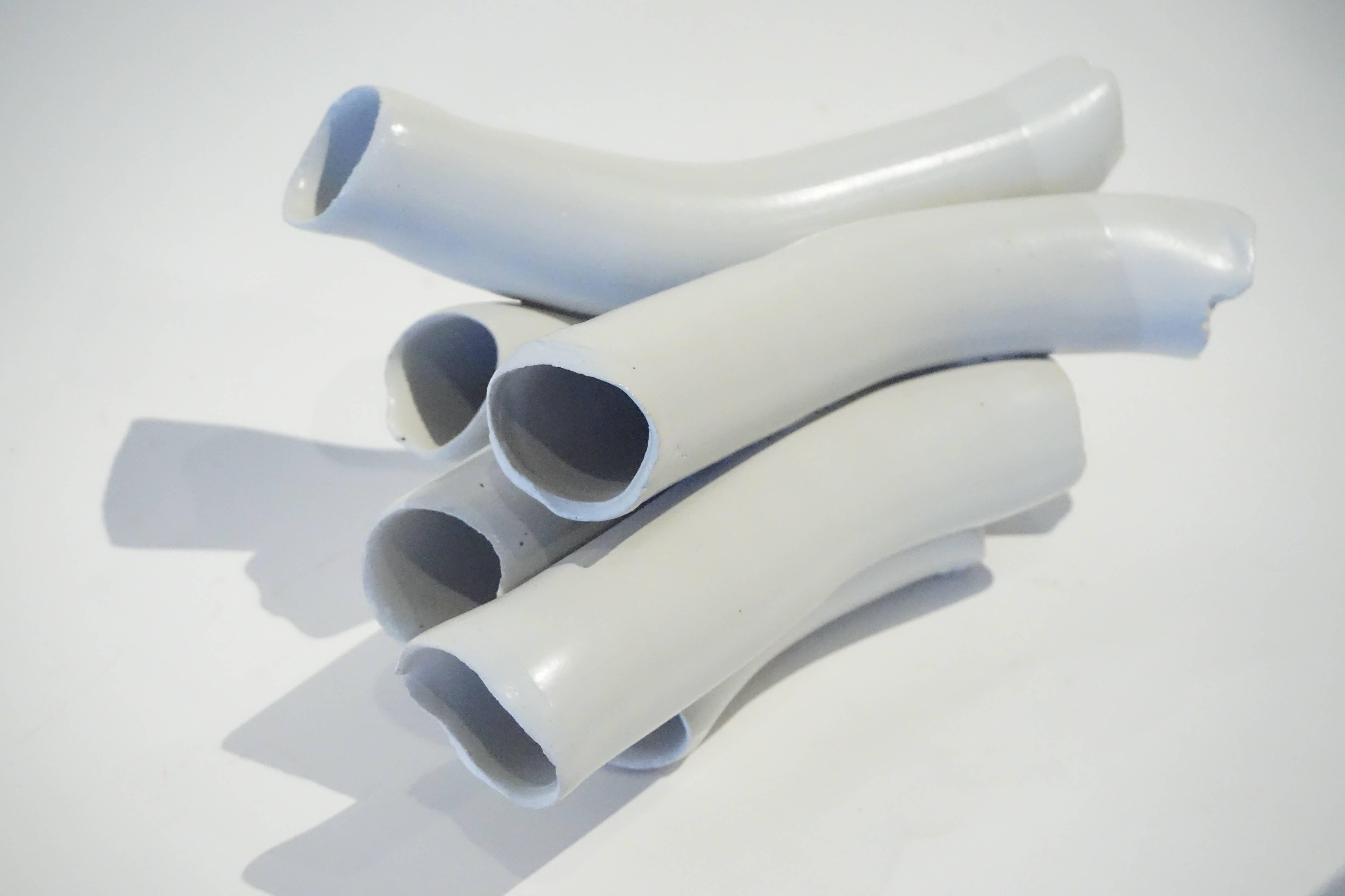 A tubular white glazed ceramic sculpture by studio potter Warner Walcott, circa 2015.