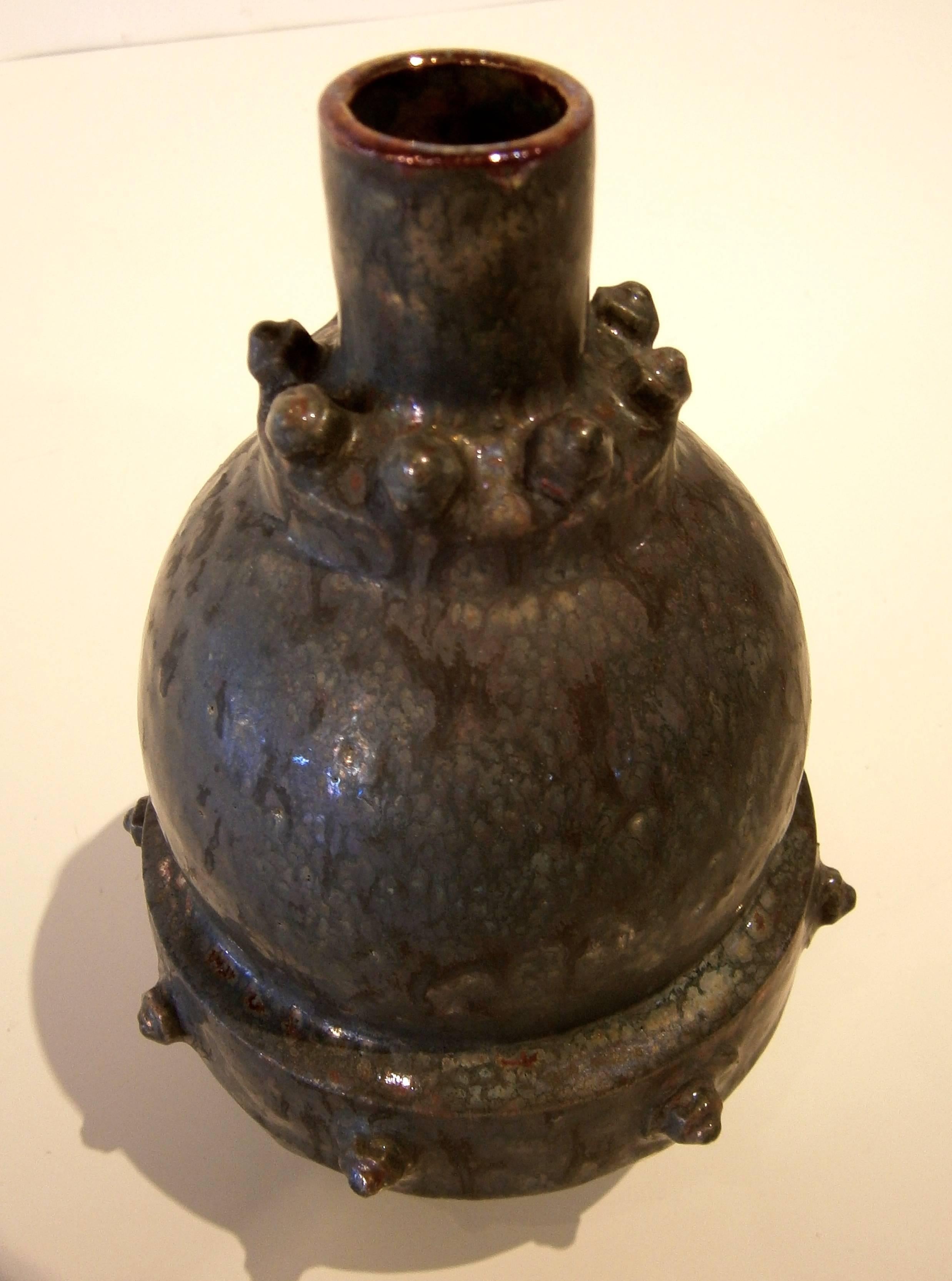 A sculptural studio pottery vessel by renowned California ceramicist Richard Flores. Part of his 