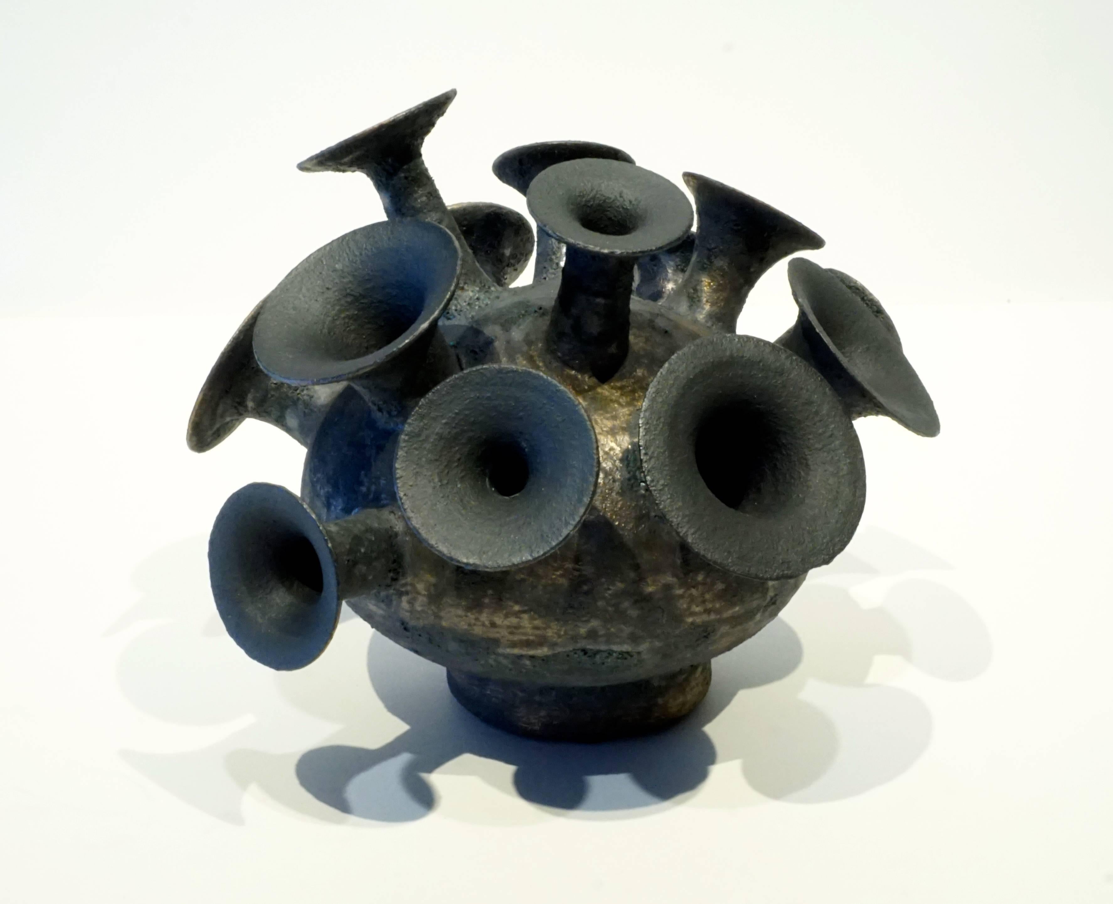 A dynamic multi spout sculptural ceramic vessel by American studio potter Jeremy Gercke.