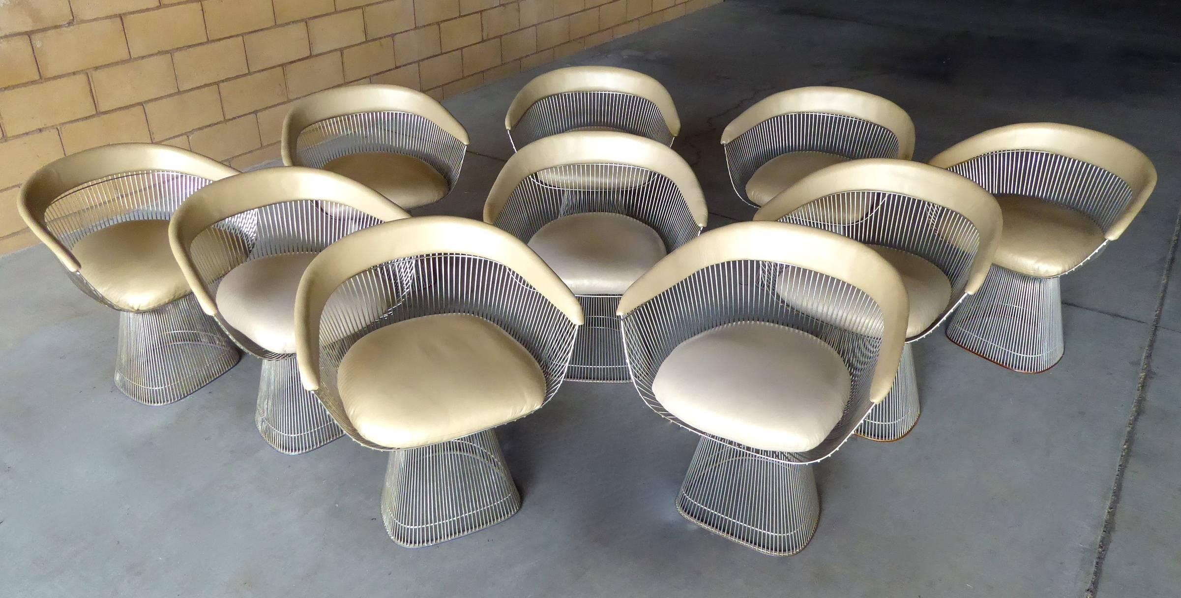 A superb set of ten nickel-plated dining chairs designed by Warren Platner for Knoll International in the 1960s. This set is from the 1980s and has been reupholstered in a soft, high-quality taupe colored leather. A matching set of this size is