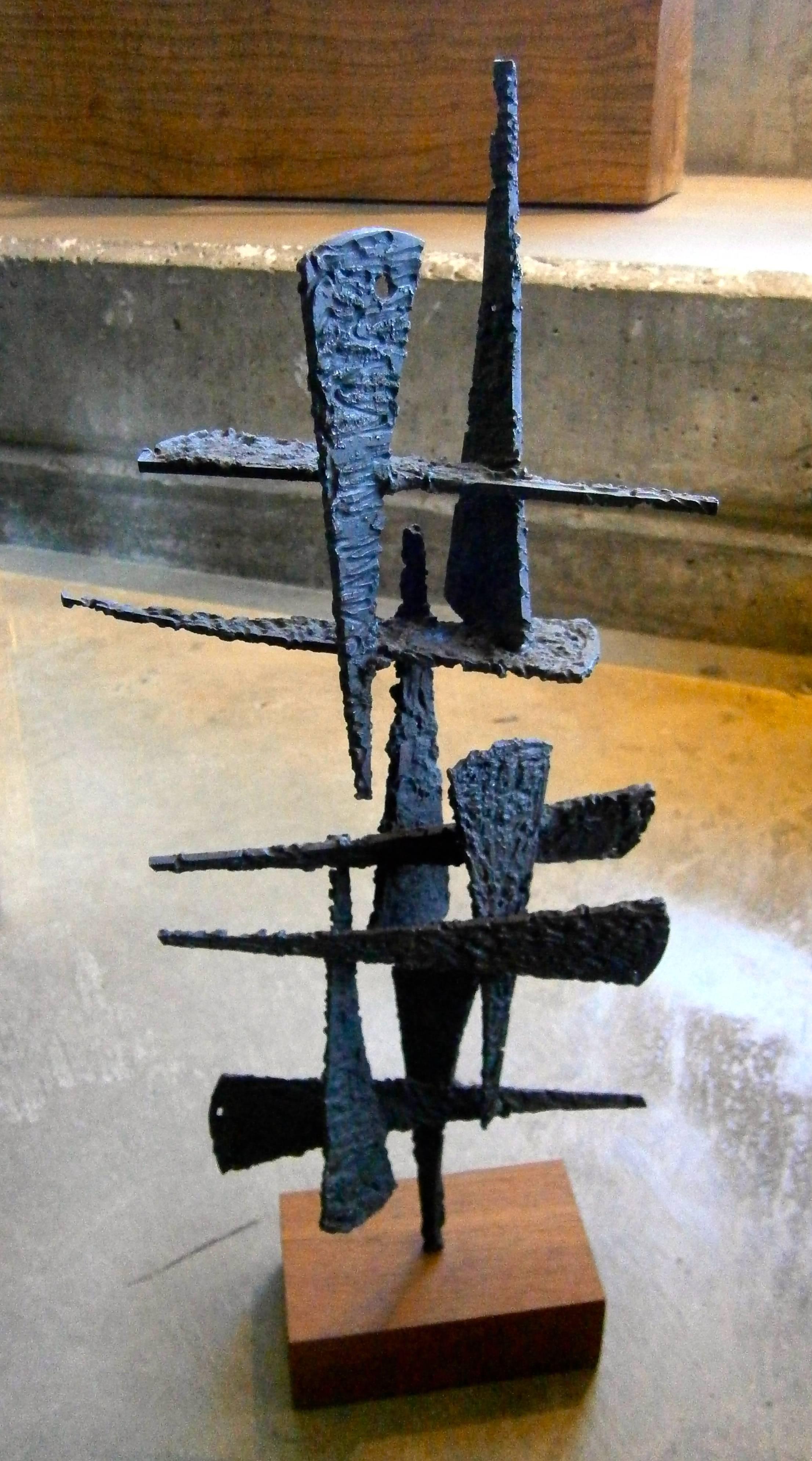 A contemporary torch-cut steel Brutalist sculpture by American artist Joey Vaiasuso. The artist has handled the use of a hard-edged material, in this case torch-cut blackened steel and created a delicate, well-balanced composition. The sculpture has