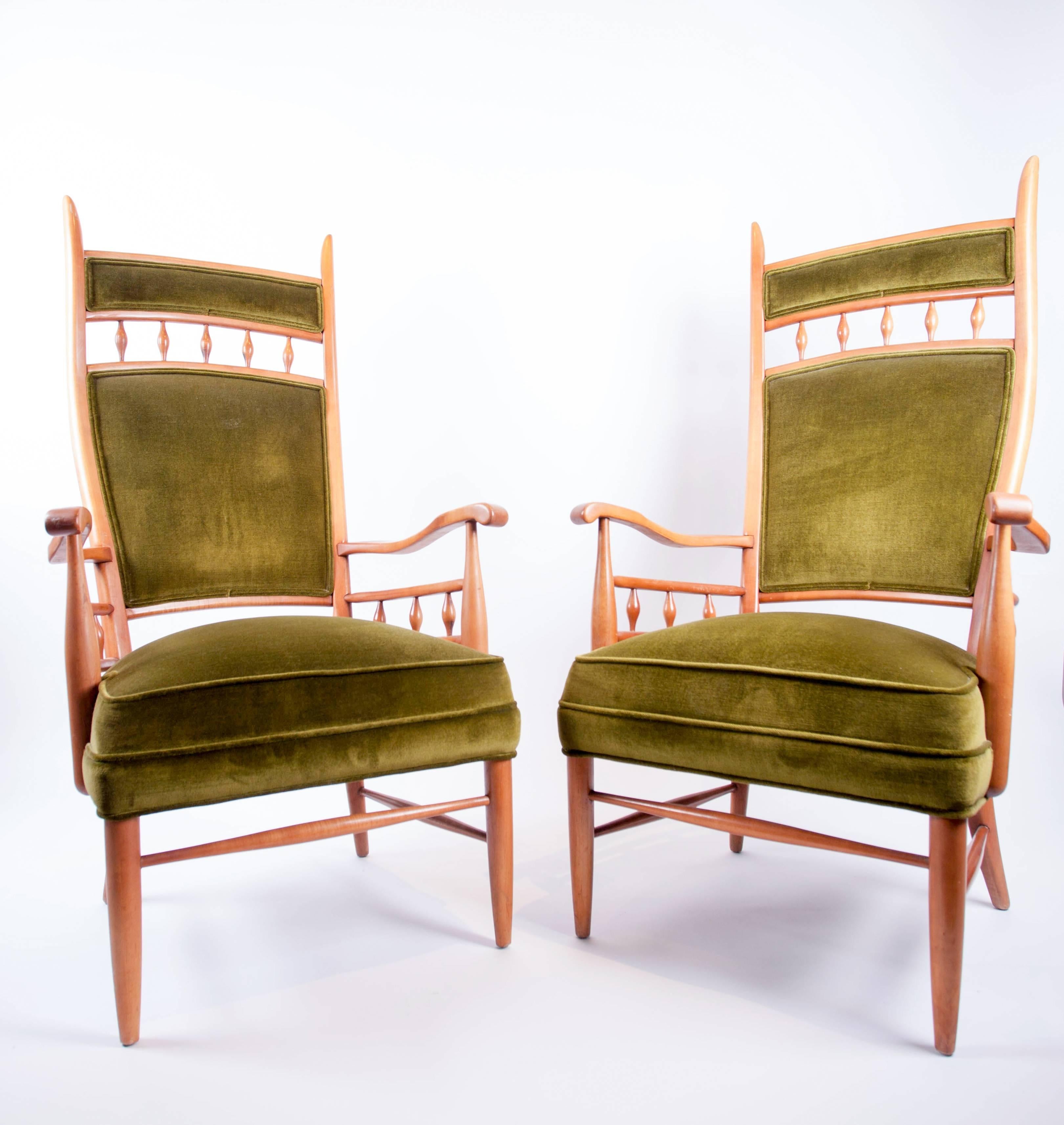 A fanciful pair of tall, fruitwood framed armchairs in the style of Edward Wormley for Dunbar. Manufactured by Maxwell Royal. Circa 1950s.  This pair has turned spindles under the arms and below the back rail. The pair is being sold in vintage