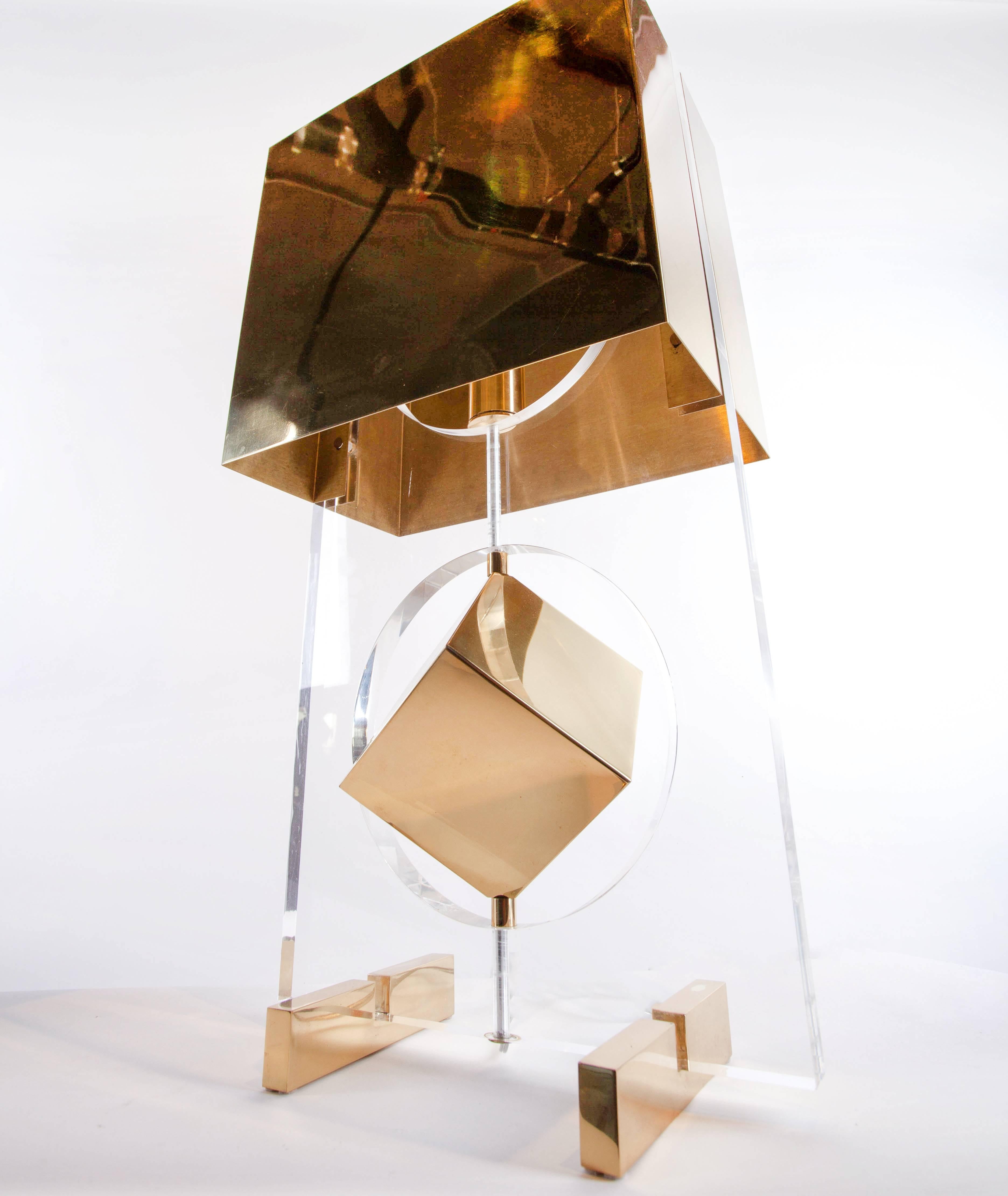 Unusual brass and acrylic lamp with a cube suspended in a center circular opening with brass shade, C. 1980s