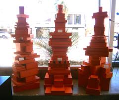 An imposing sculptural presentation of over 100 Hermes Gift Boxes