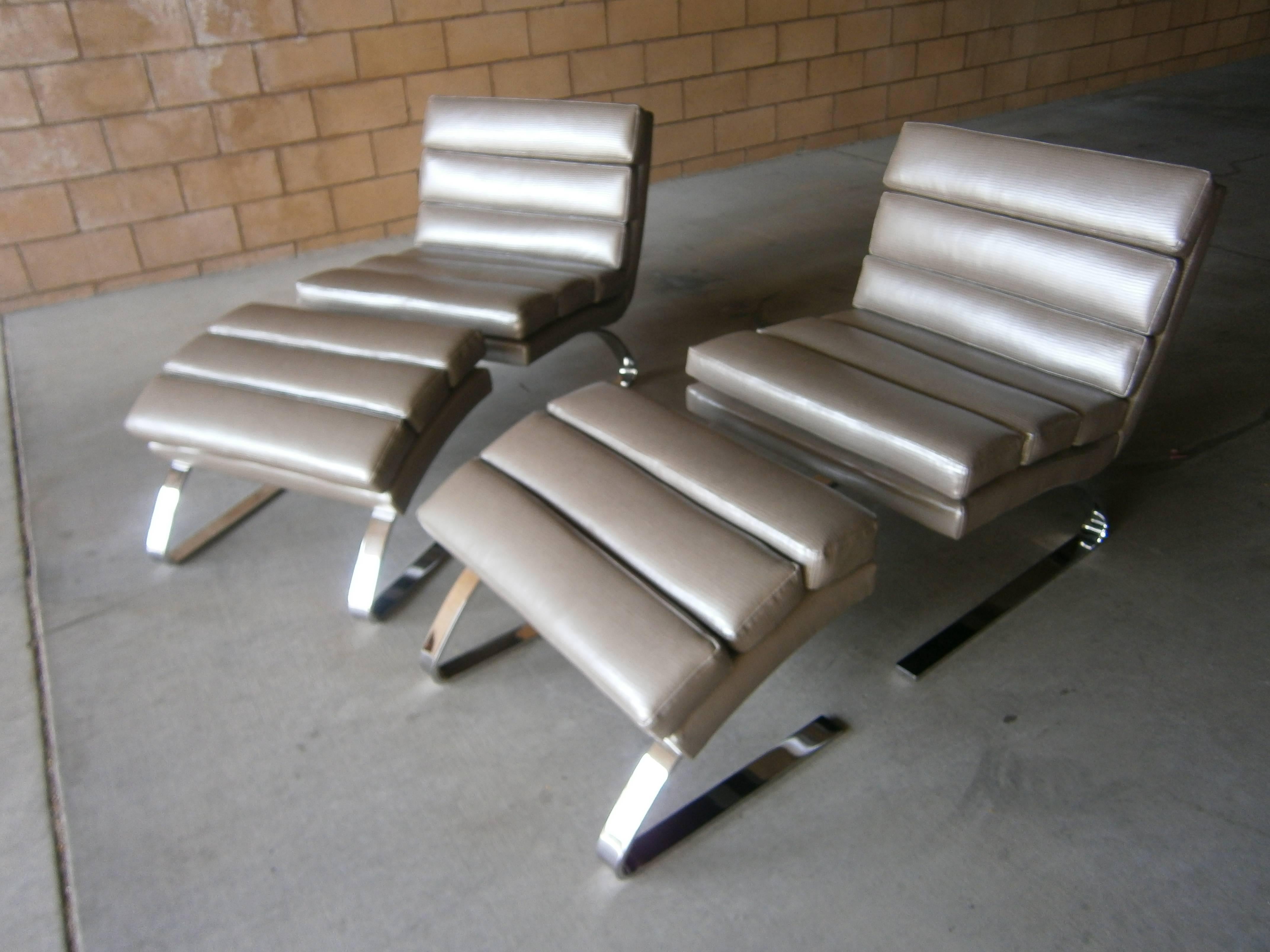 A vintage cantilevered lounge chair and ottoman with chrome-plated solid flat bar steel legs from the 1990s. All pieces have been newly reupholstered using a snakeskin patterned high quality vinyl. Because of the nature of the cantilevered design,