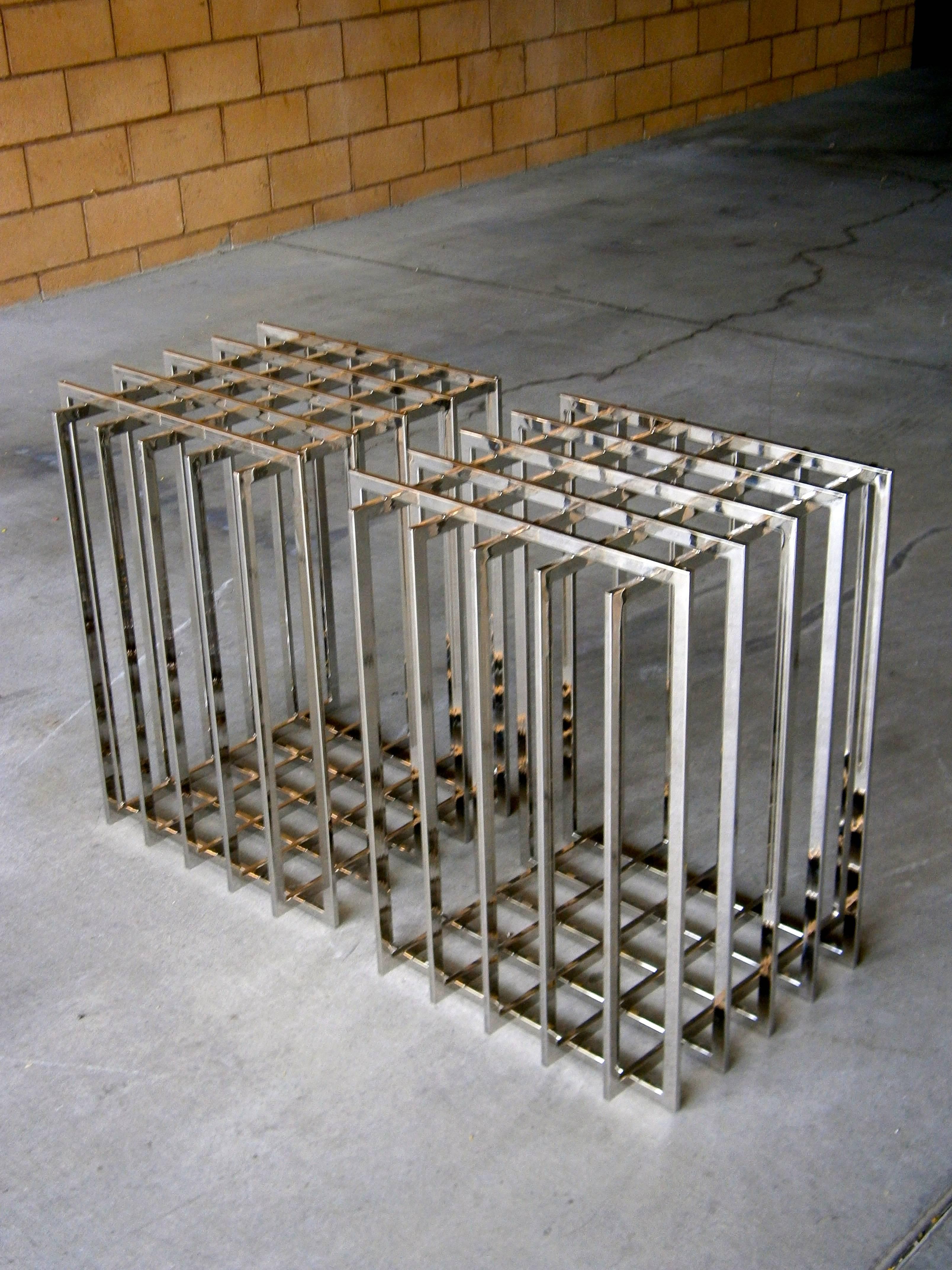 A pair of moveable, cage-form dining table bases by Pierre Cardin C. 1970s. The  table bases 