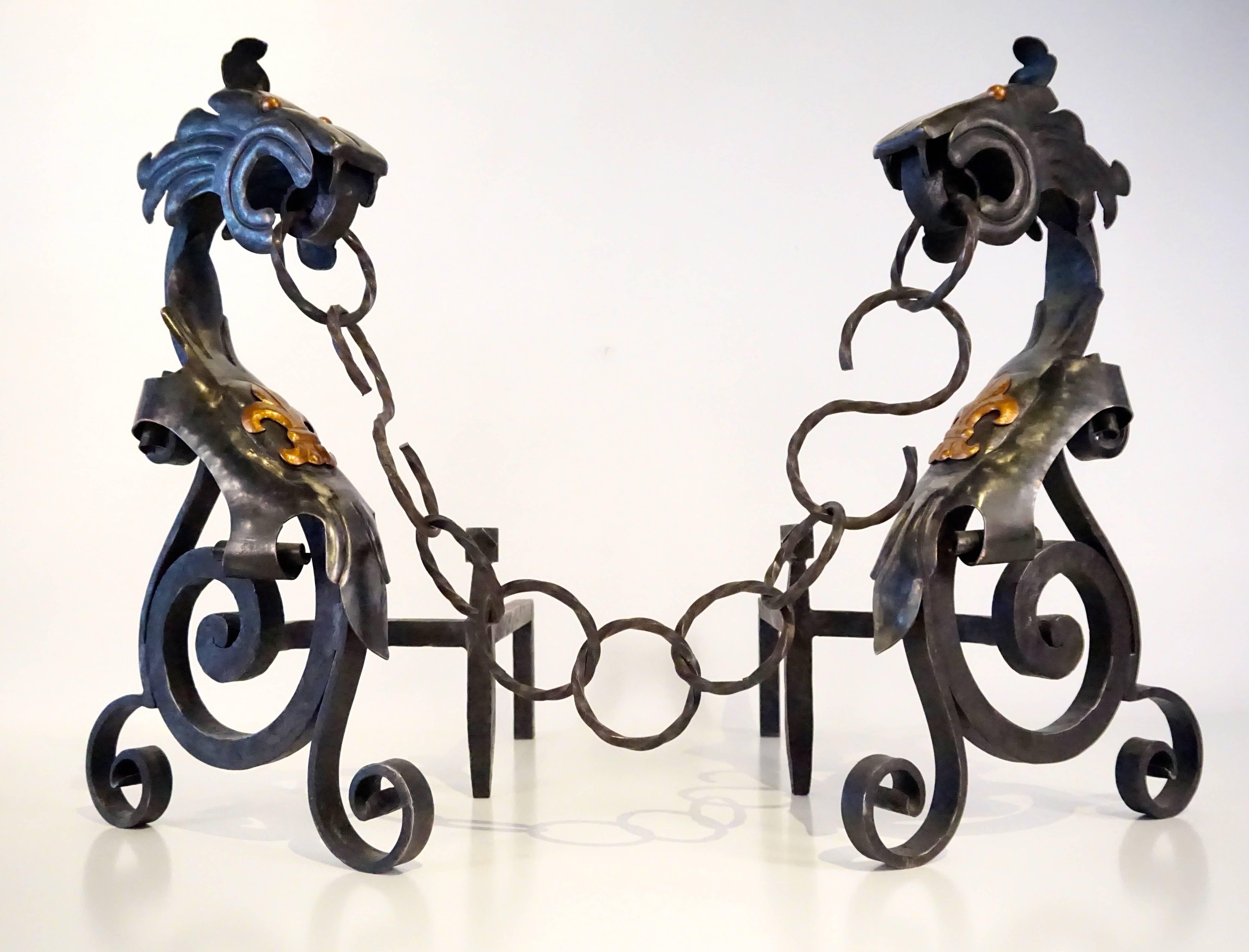 A fabulous pair of French medieval style hand wrought andirons. This pair has a wonderful large scale presence. The chain links are twisted iron and the dragon heads are particularly well rendered. These are in amazing condition.
Dimensions shown