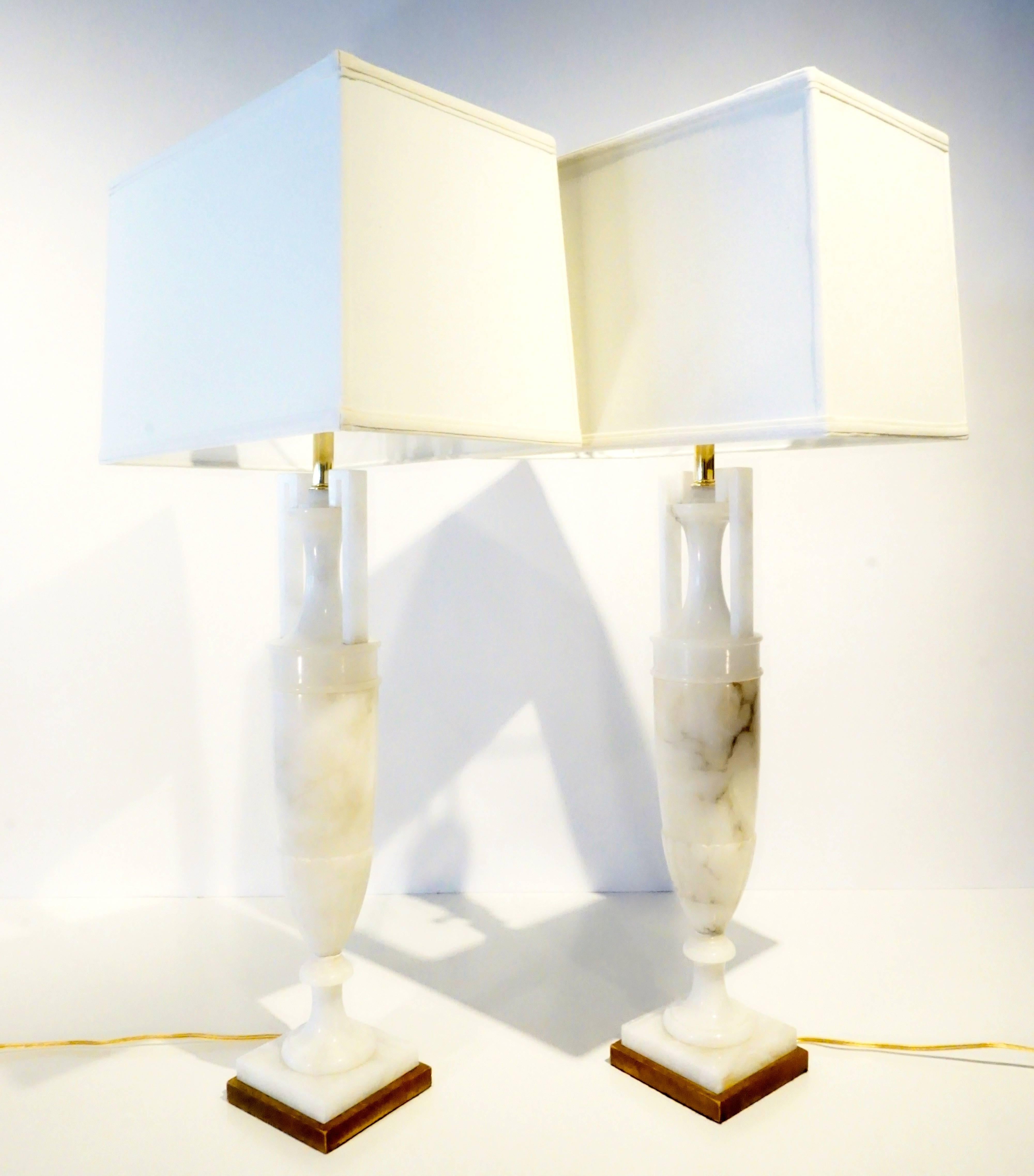 A classic pair of Italian alabaster urn form lamps C. 1950's.
These lamps are newly rewired and also come with new shades, as shown.