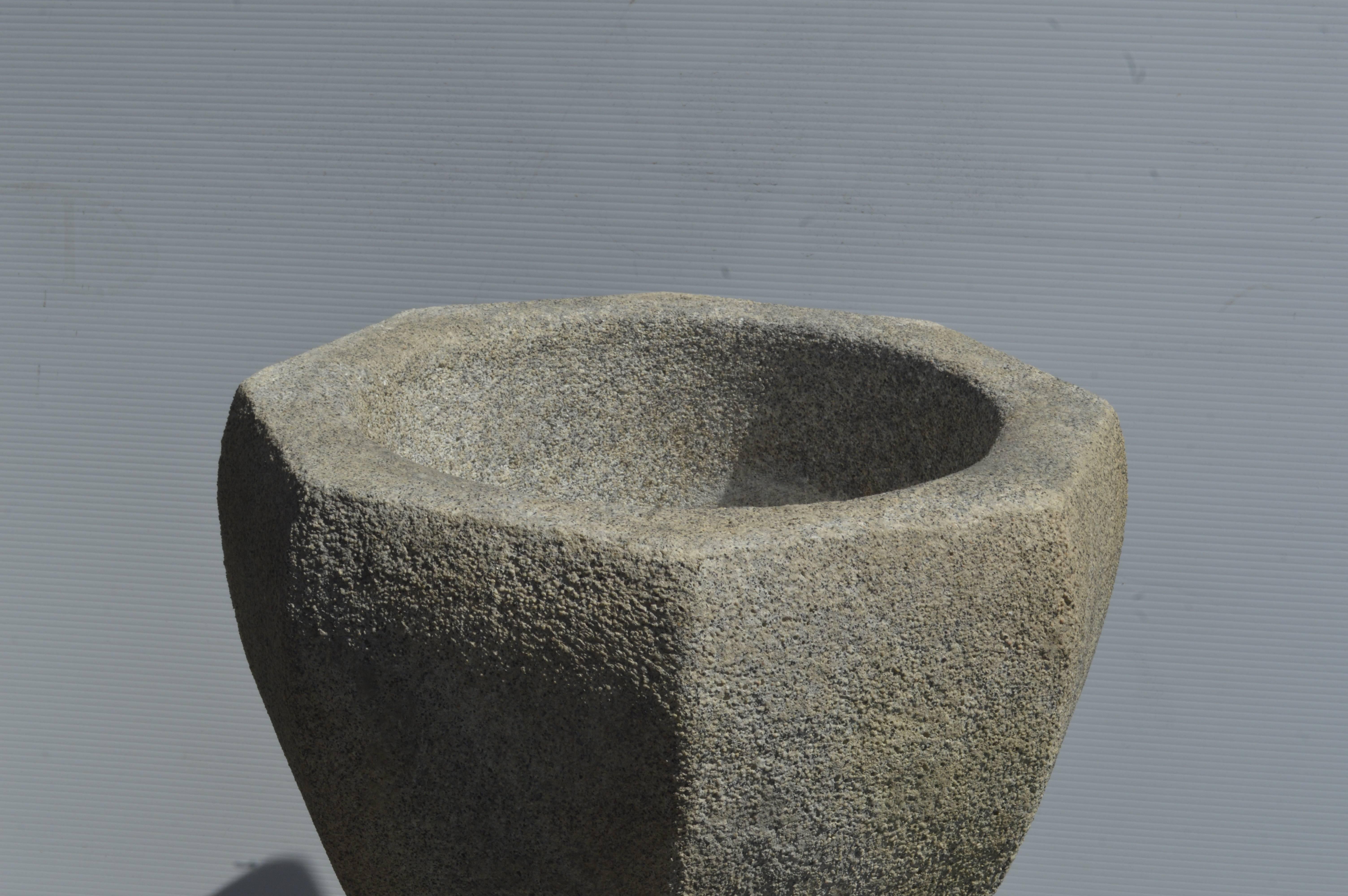 Beautifully cast cement octagonal urns/planters on a pedestal.