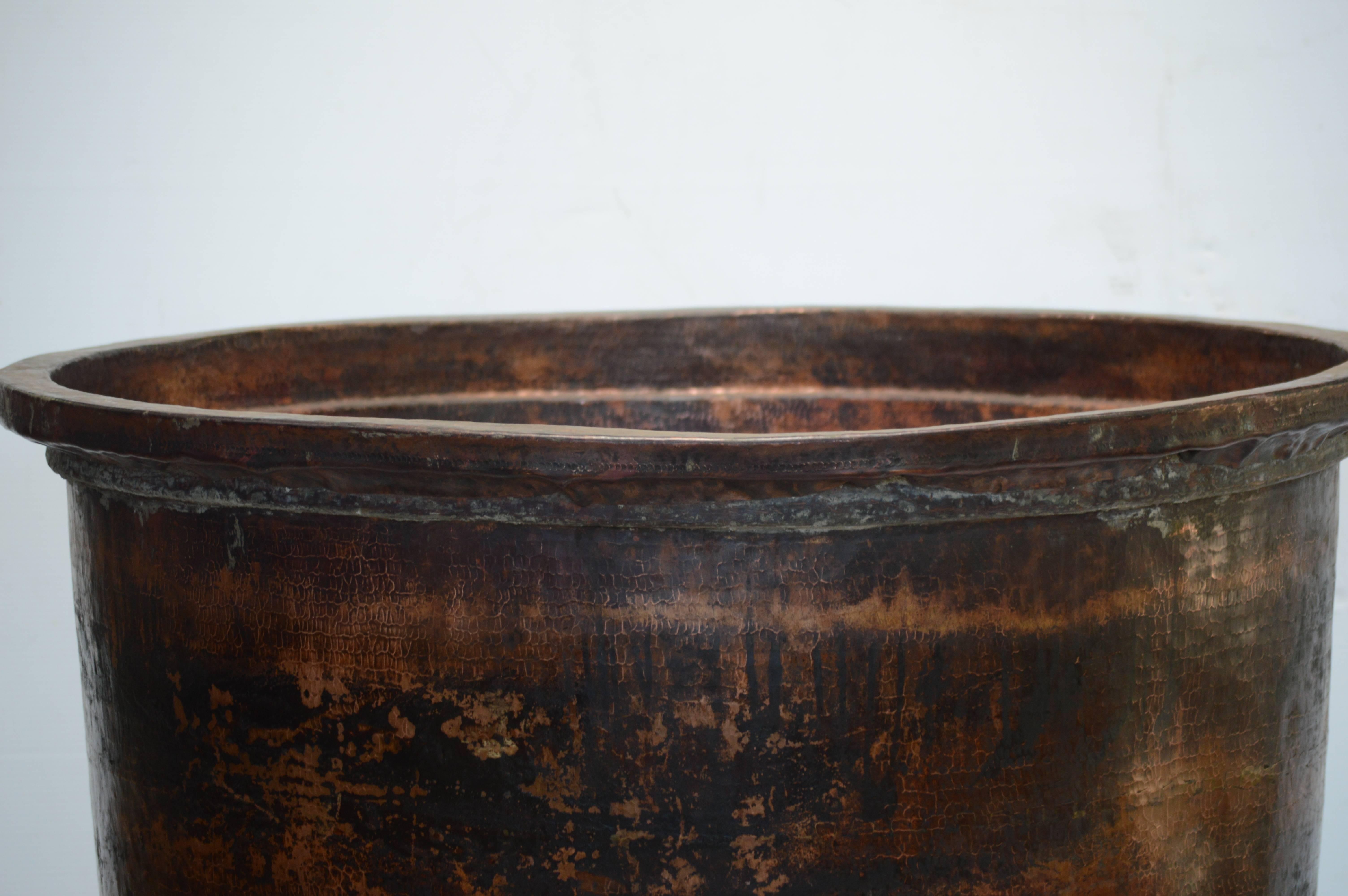 Antique vessel from Batik workshop, handmade copper with patina of age and wear.