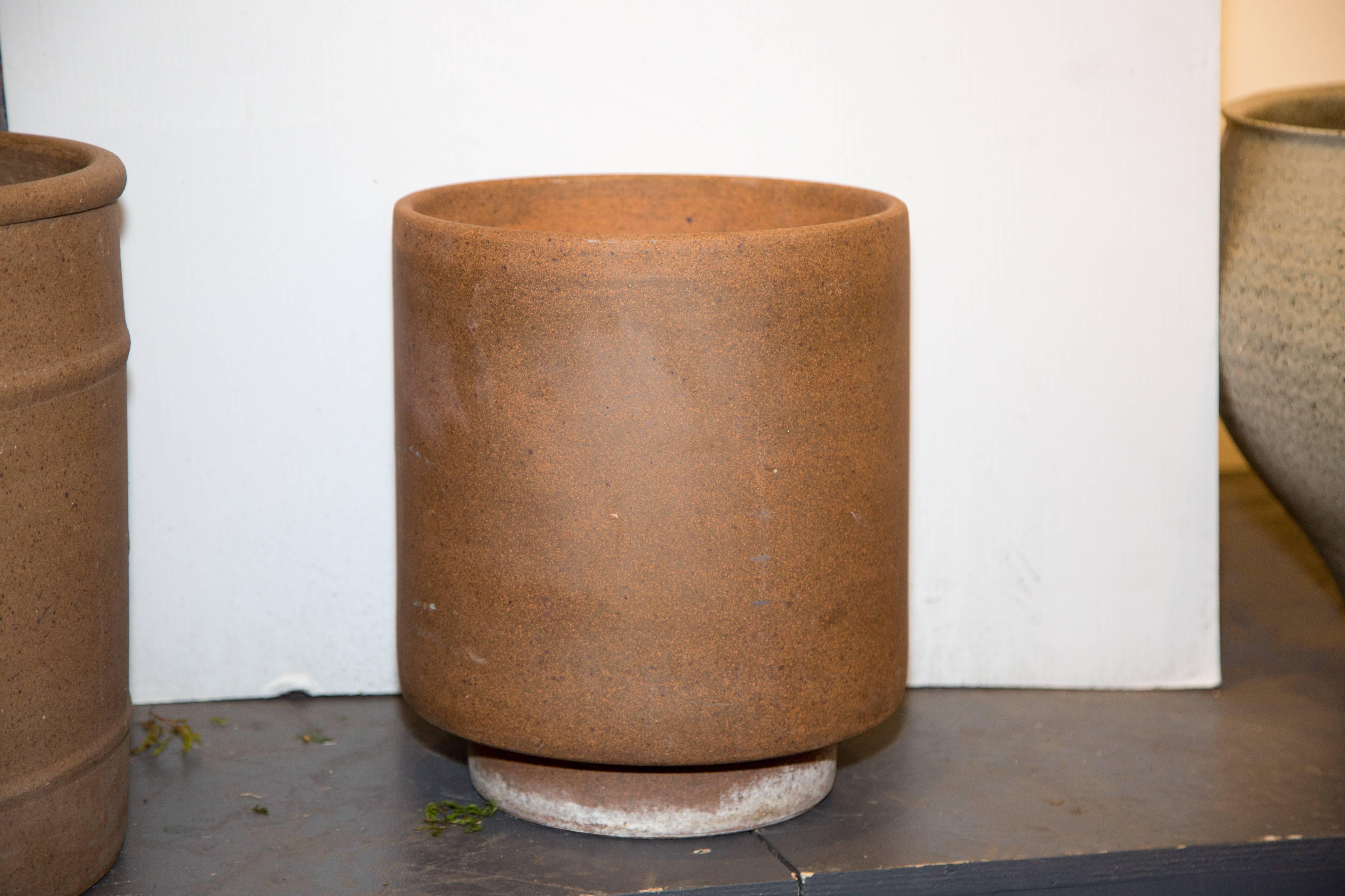 Pro artisan David Cressey unglazed cylinder planter, California, 1960. Measures: 12'' D x 14'' H, $1450 list.