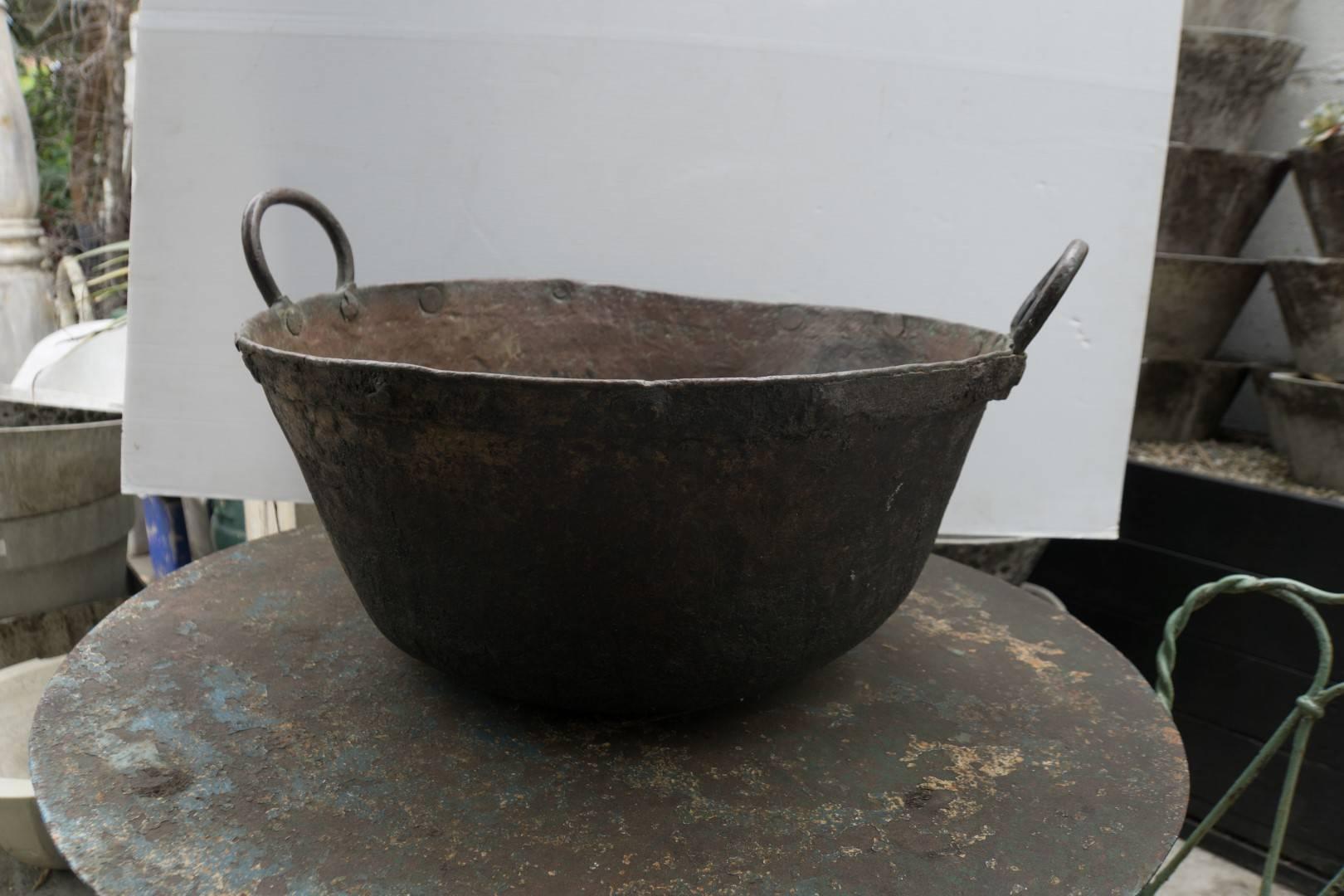 Copper cookpot with handles, 19th century, American,
Measures: 25'' D x 10'' H 
$1,800.00.