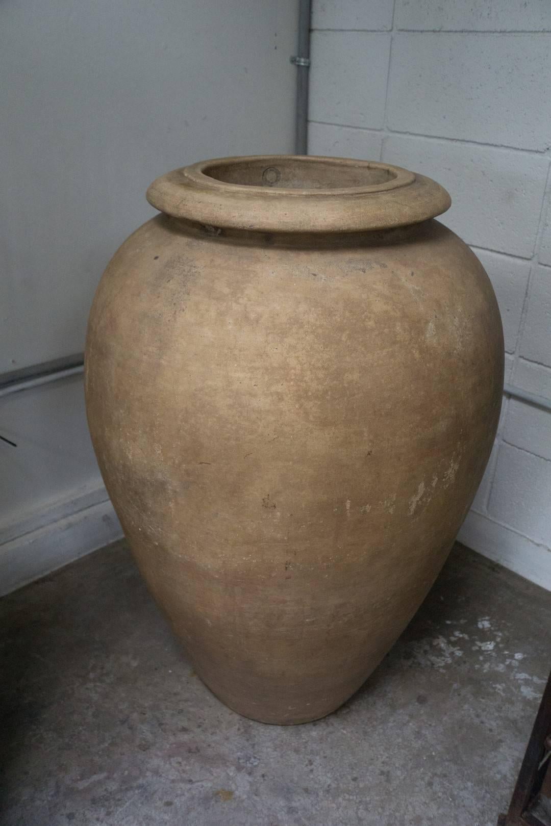 Mid-Century Modern Italian terracotta company Bisque oil jar
 Measures: 26'' OD x 10'' ID x 37'' H 
$7,500.00.