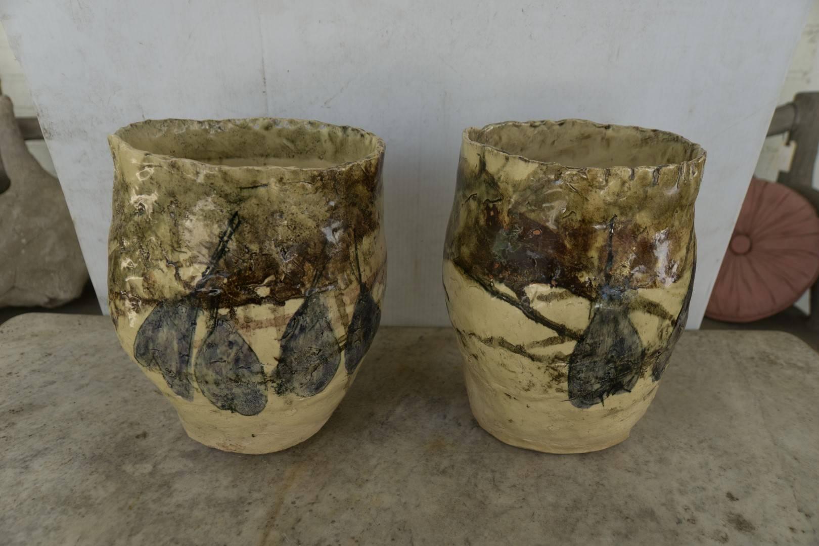 French Mid-Century Modern pair of hand thrown terra cotta vases in yellow glaze with figs painted on
Measures: 8” D x 10” H
$450.00ea.