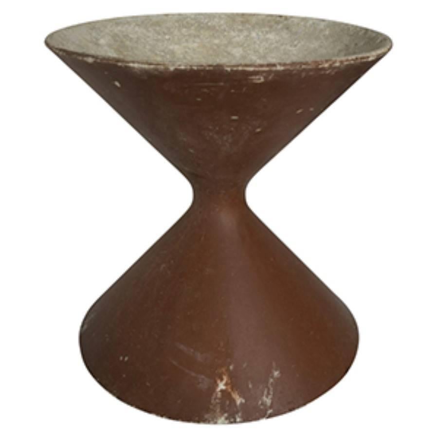 Modern French hourglass Diabolo planter. This Diabolo hourglass is slightly taller than knee high, and would make a great companion piece to any larger hourglass planters as well as another one of the same size. Painted in a deep maroon color, this