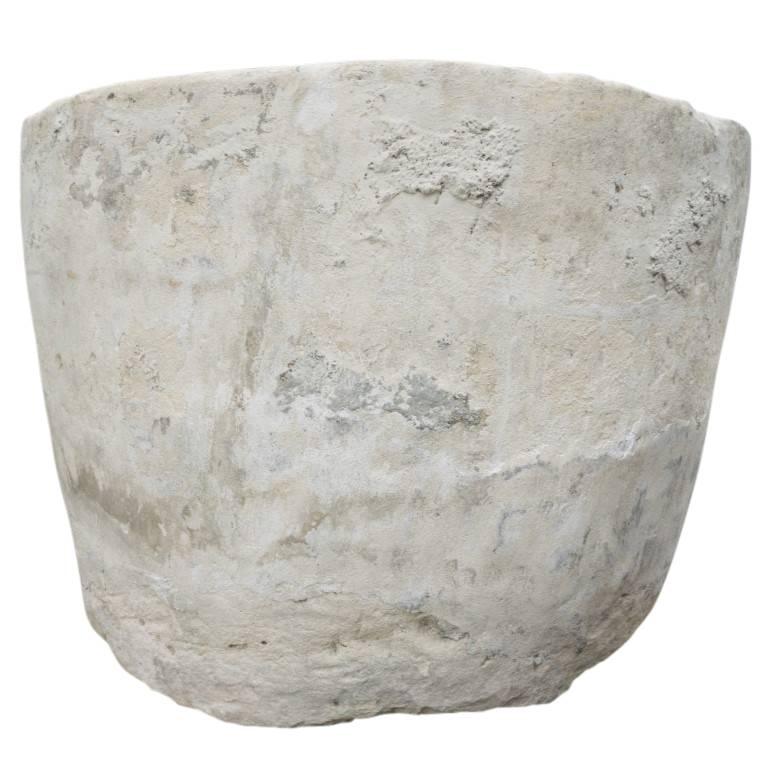 Originating in Java, Indonesia, circa 1900, this antique vessel is comprised with a stimulating blend of colors. Having a life and character all its own this is limestone planter is as unique and organic as anything one would choose to plant inside