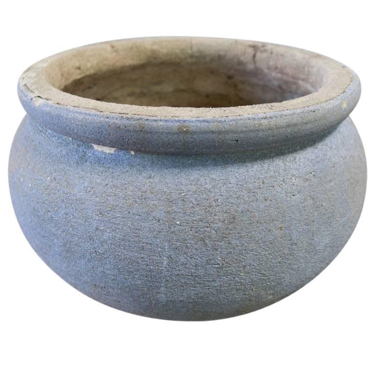This rare cement planter combines styles one would find in vintage European vessels with a color and patina of vintage American. The planter is heavy and solid standing 12 inches tall and 17 inches wide in its outside diameter with the inside