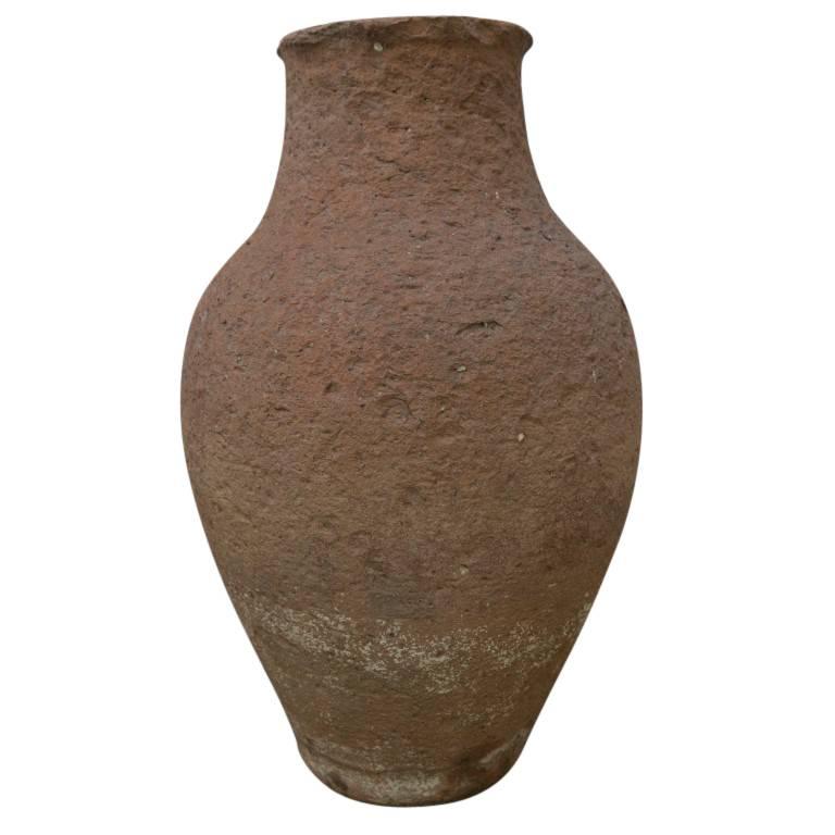 A charming little oil jar perfect for a shelf among your indoor plantscapes or as an enhancement to your decorative outdoor landscape. Exemplifying an aged tradition of handmade terracotta, a vase shaped oil jar of only 14 inches tall and 8 inches