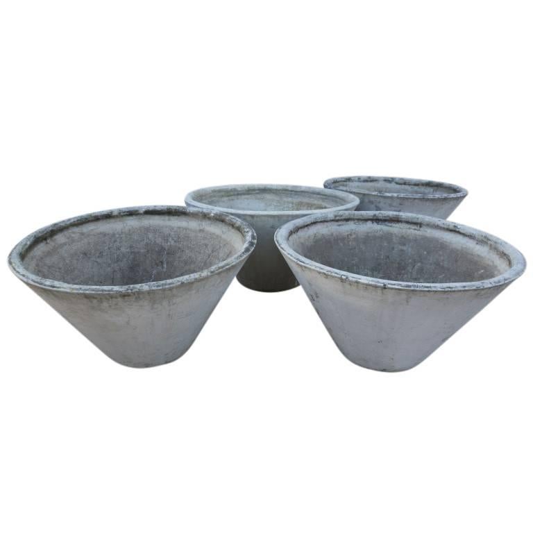 The style and design of conical planters creates a natural feeling of admiration when viewed in a landscape design or crafted interiors. These French cement conical planters are nearly 30 inches in Diameter and 18 inches tall. They have a lovely