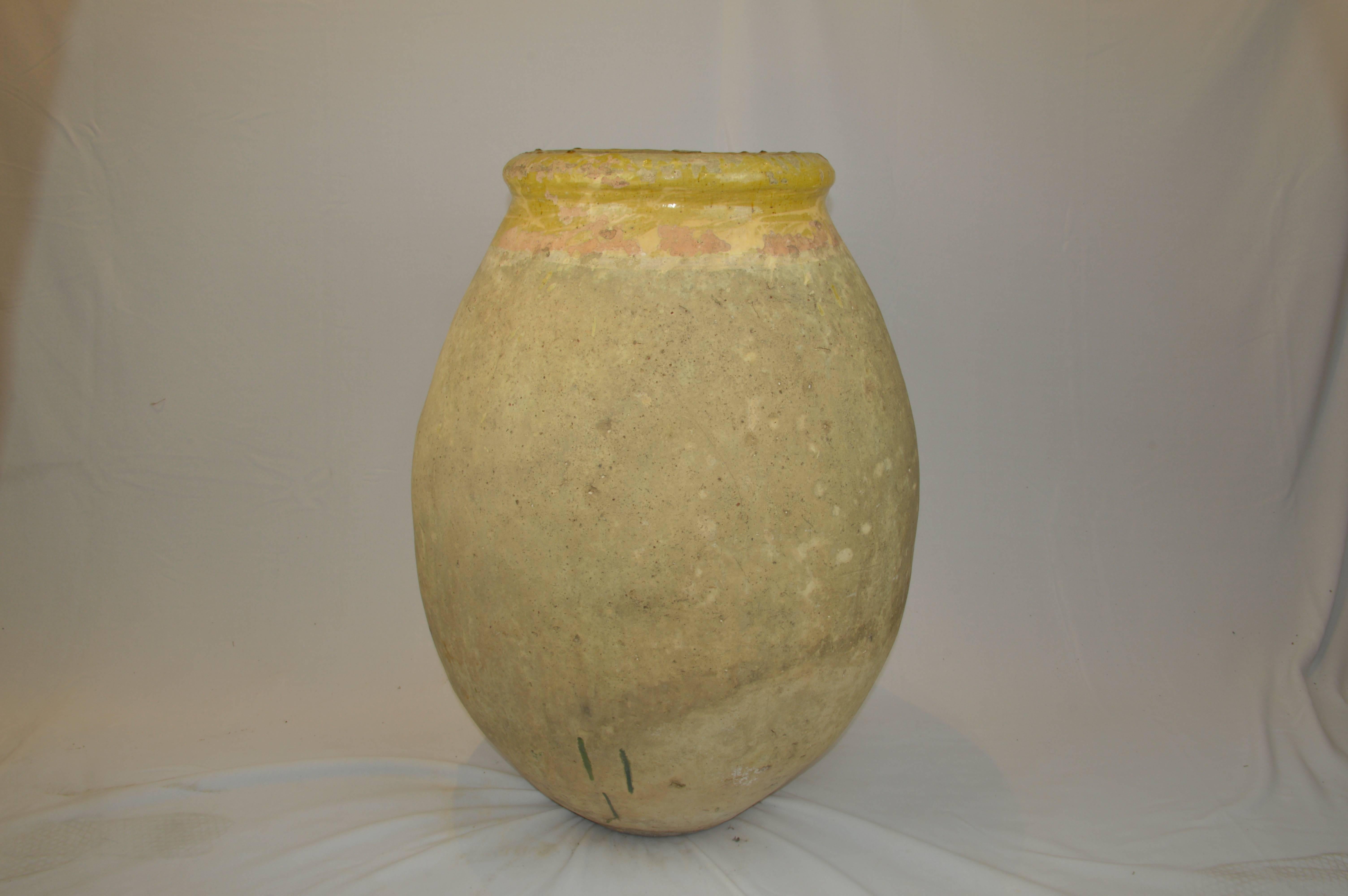 Antique French terracotta storage jar with yellow glazed rim from Biot.