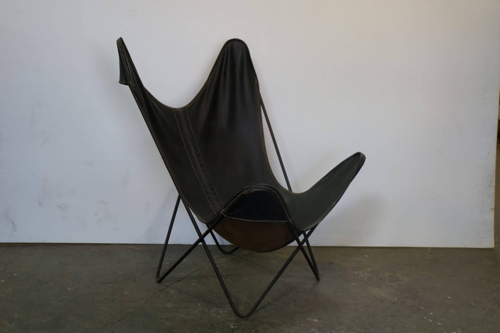 Mid-Century Modern butterfly style stackable iron framed leather chairs, original leather middle seam redone designed by J. Kurchan, J. Ferrari, A. Bonet for Airborne. 
Measures: 28 x 24 x 36
$3500 list.