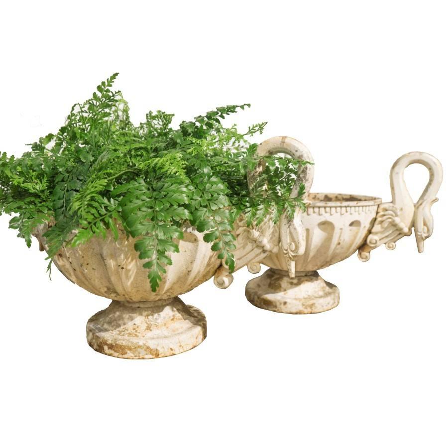 French antique urns for the home or garden, circa 1930, these French urns could easily be from the late 19th century based on the similarity to swan handle urns from that era. Made of cast iron and painted white with a large 14 inch rim bowl that is