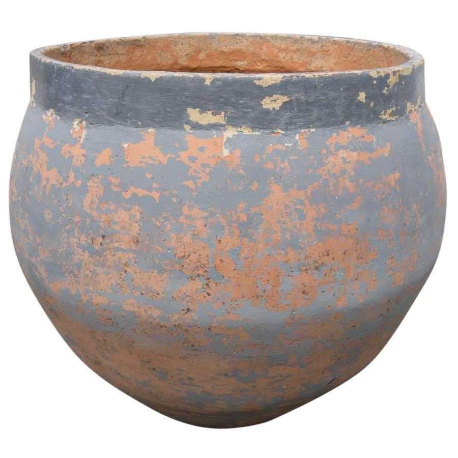 These Spanish antique terracotta planters are awe-inspiring. Two rather large planters at just under 3 feet in height and diameter, covered in a smooth blueish grey glaze chipped away in some areas giving them the attention grabbing character