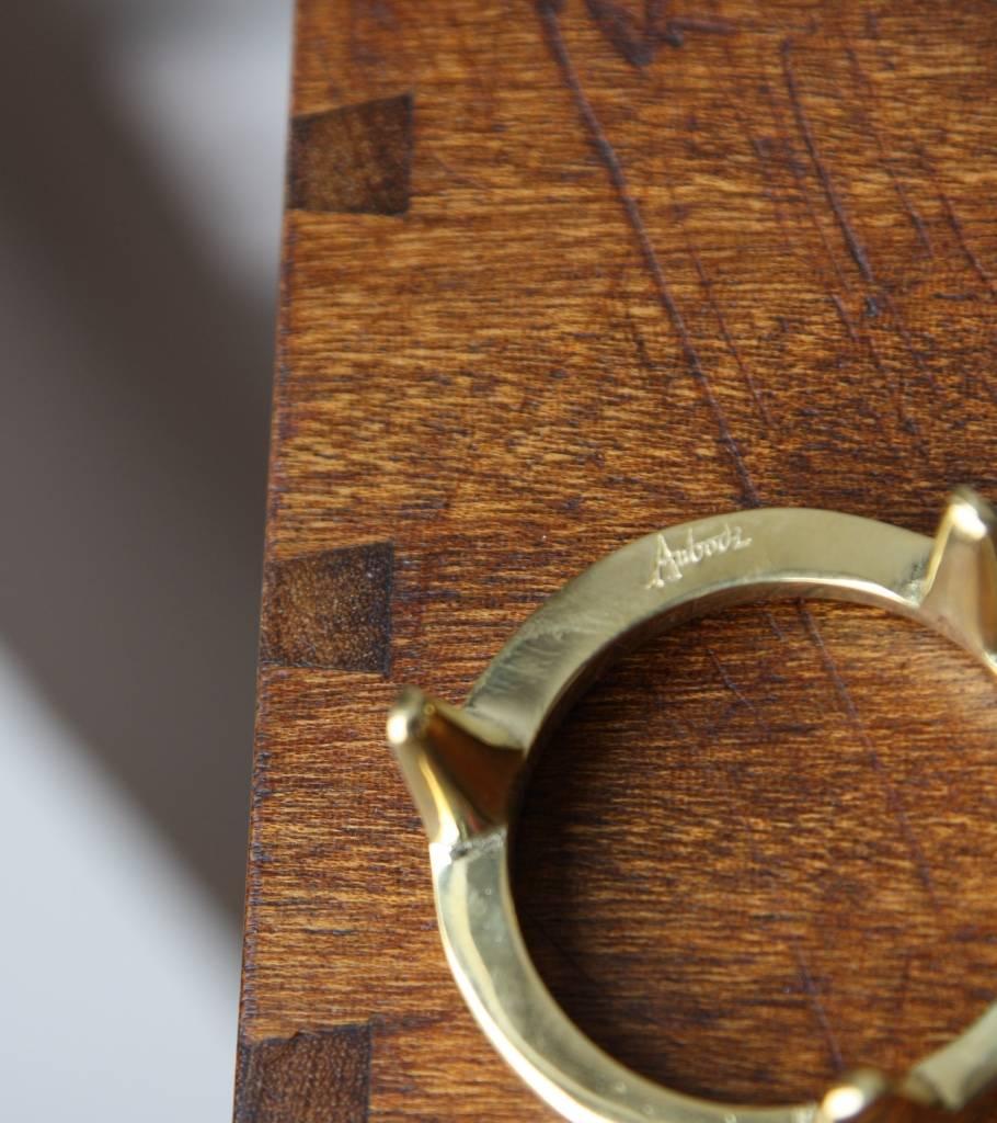 Set of six egg brass cups and walnut tower by the Auböck Werkstätte, Vienna, Austria circa 1950.
The sculptural 'tower' housing the brass rings is made out of carved walnut, one of the rings is stamped Auböck.
In excellent condition.