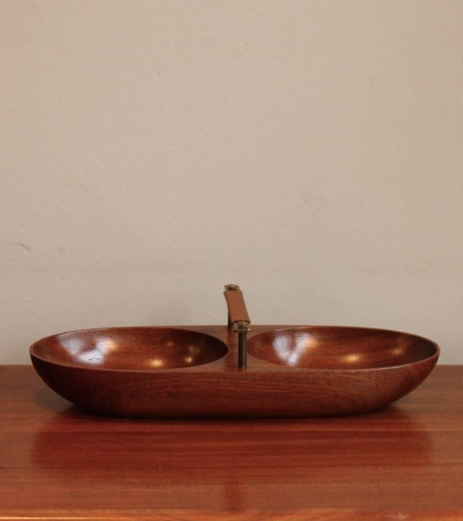 Double bowl hand-carved in teak with cast brass handle by Carl Auböck. The teak has a lovely rich colour and smooth finish.