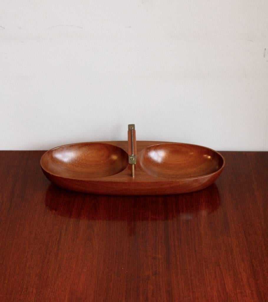 Double bowl hand-carved in teak with cast brass handle by Carl Auböck. The teak has a lovely rich colour and smooth finish.
