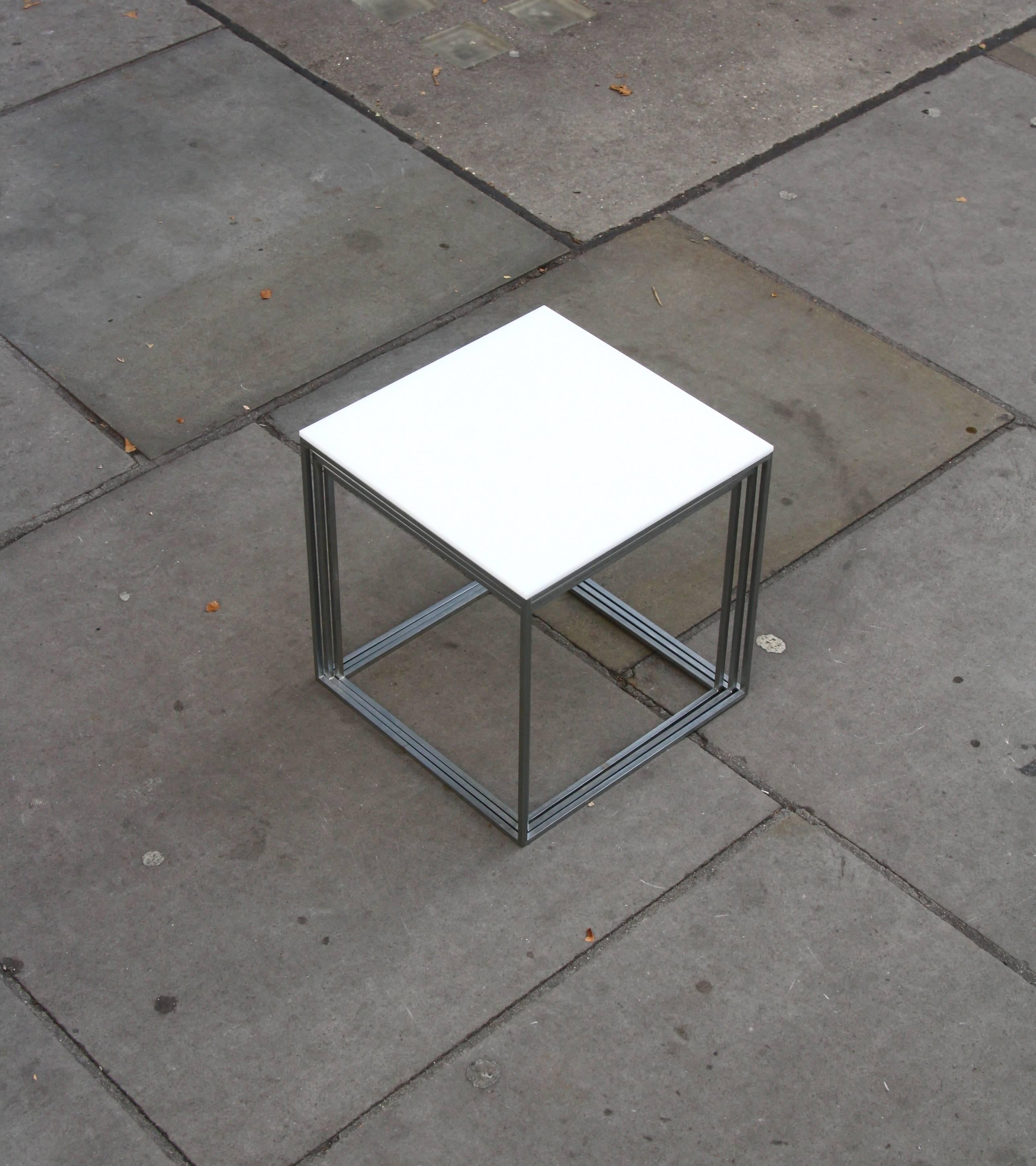 A complete vintage set of three PK71 nesting tables designed by Poul Kjærholm in 1957, manufactured by his friend E. Kold Christensen.

A true triumph in Minimalist design the side tables are simply three slender steel frame cubes fitted with