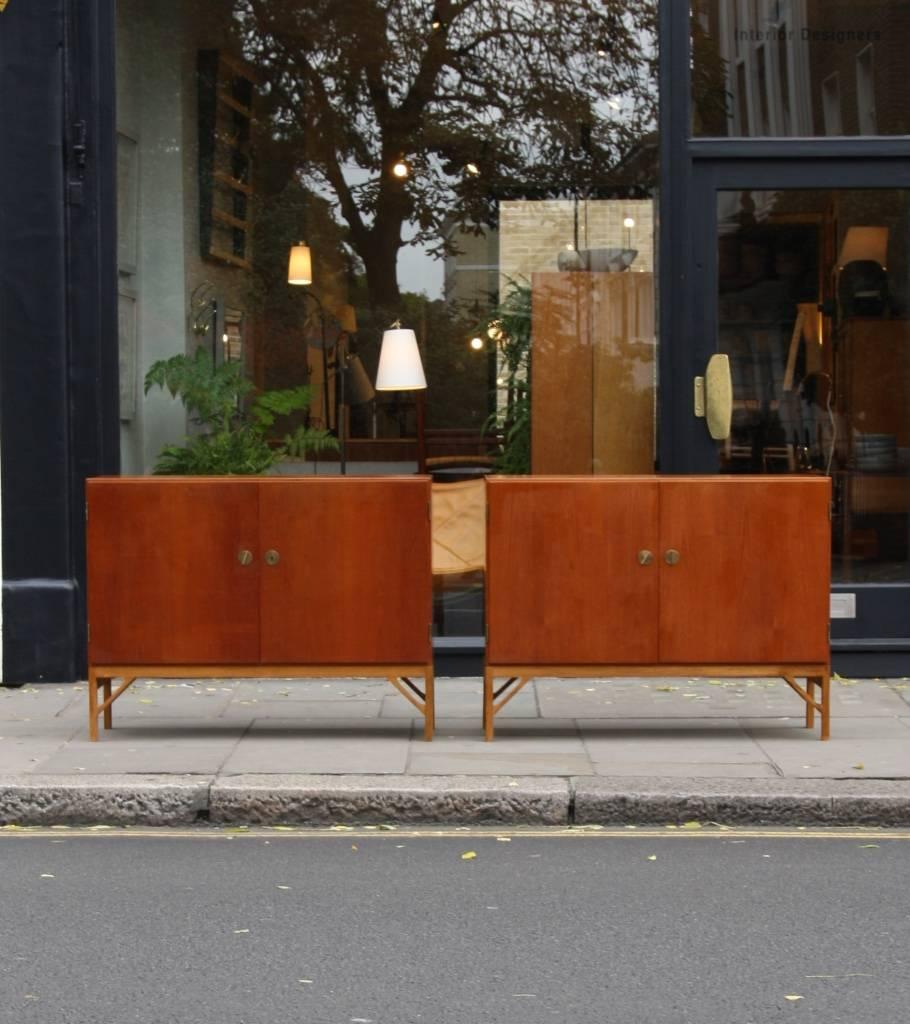 A pair of model 232 sideboards designed by Børge Mogensen in 1951. 
The units, standing on oak legs are made of teak and have a number of shallow drawers and shelves in beech, which can be moved and adjusted.
Extremely functional and in overall