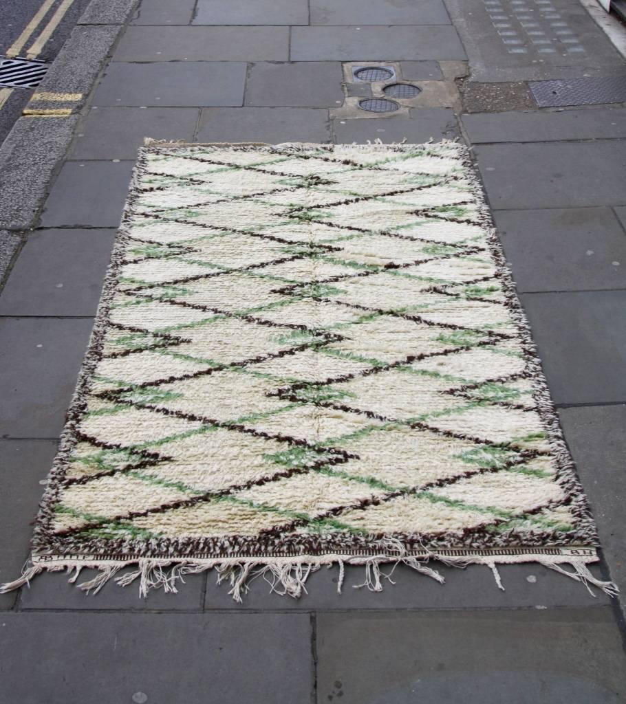 Pile rug by Barbro Nillson and Marta Måås-Fjetterström, Sweden, 1950s.
Diagonal black and green lines run across the off-white background creating a zigzag motive, recurring in Marta and Barbro's production. 
In overall excellent conditions.