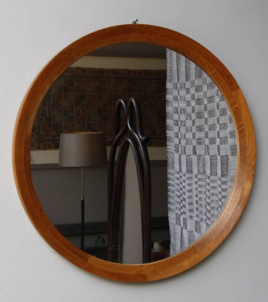 Wall mirror made in Denmark, circa 1950. The slender wooden frame has a light color between orange and ochre. It hangs with a metal hook on the back of the frame. In overall very good condition.