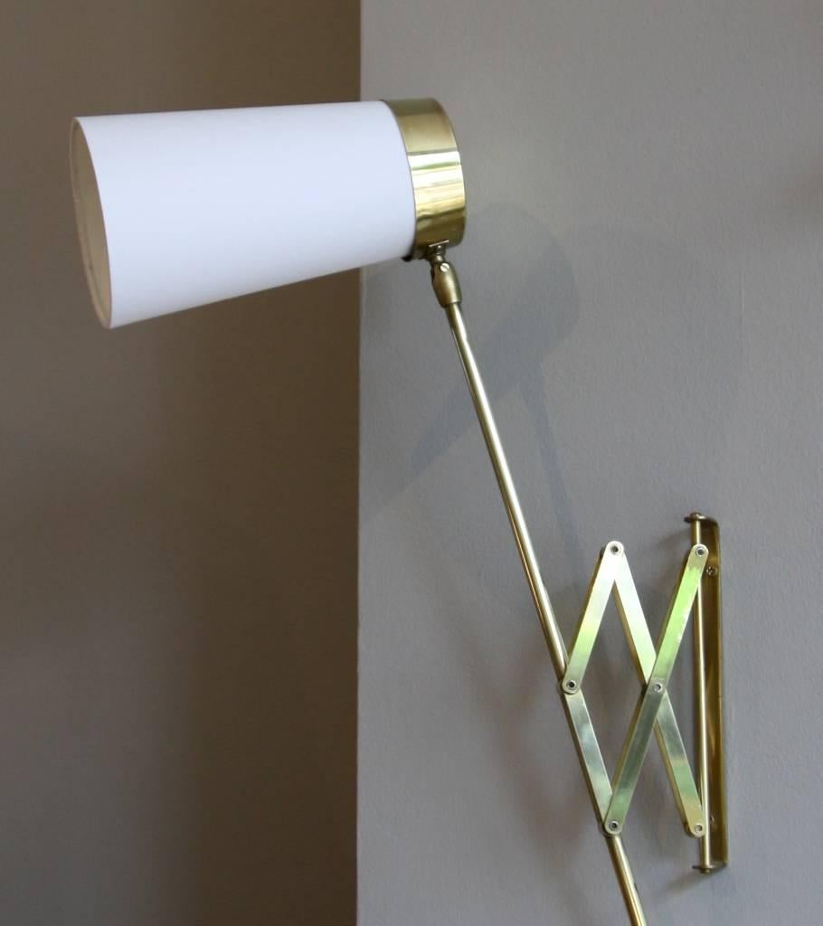 Concertina wall light in polished brass, designed and made in Denmark in 1950s.
The extendable arm can rotate around the wall support covering a 180˚ angle. The head is adjustable too.
Rewired for the UK, it comes with a blond cord, switch on the