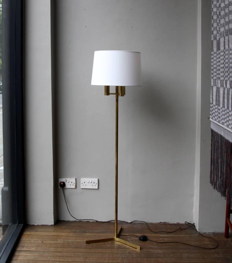 Polished brass vintage Danish floor lamp dating back to the 1960s.
The lamp has an unusual design with three bulb holders, which makes it very bright and ideal as main source of discrete light to illuminate a room.
The stem and the crow's foot base