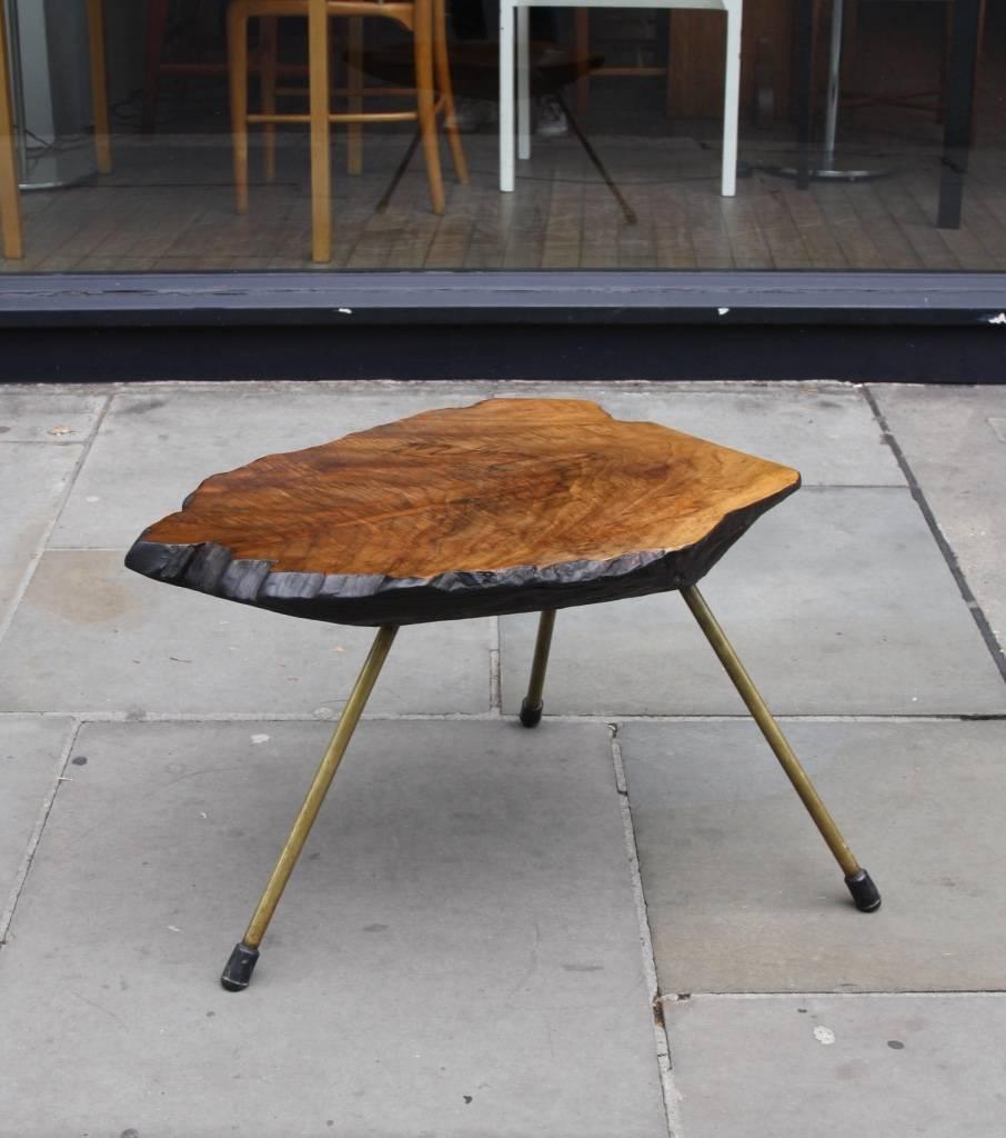 Small example of Tree Trunk table by the Auböck Werkstátte, dating to 1940s-1950s, when Carl Aubock II was designing new objects and running the business.
Made out of a chunk of solid walnut, it has three brass legs with removable rubber feet.
The