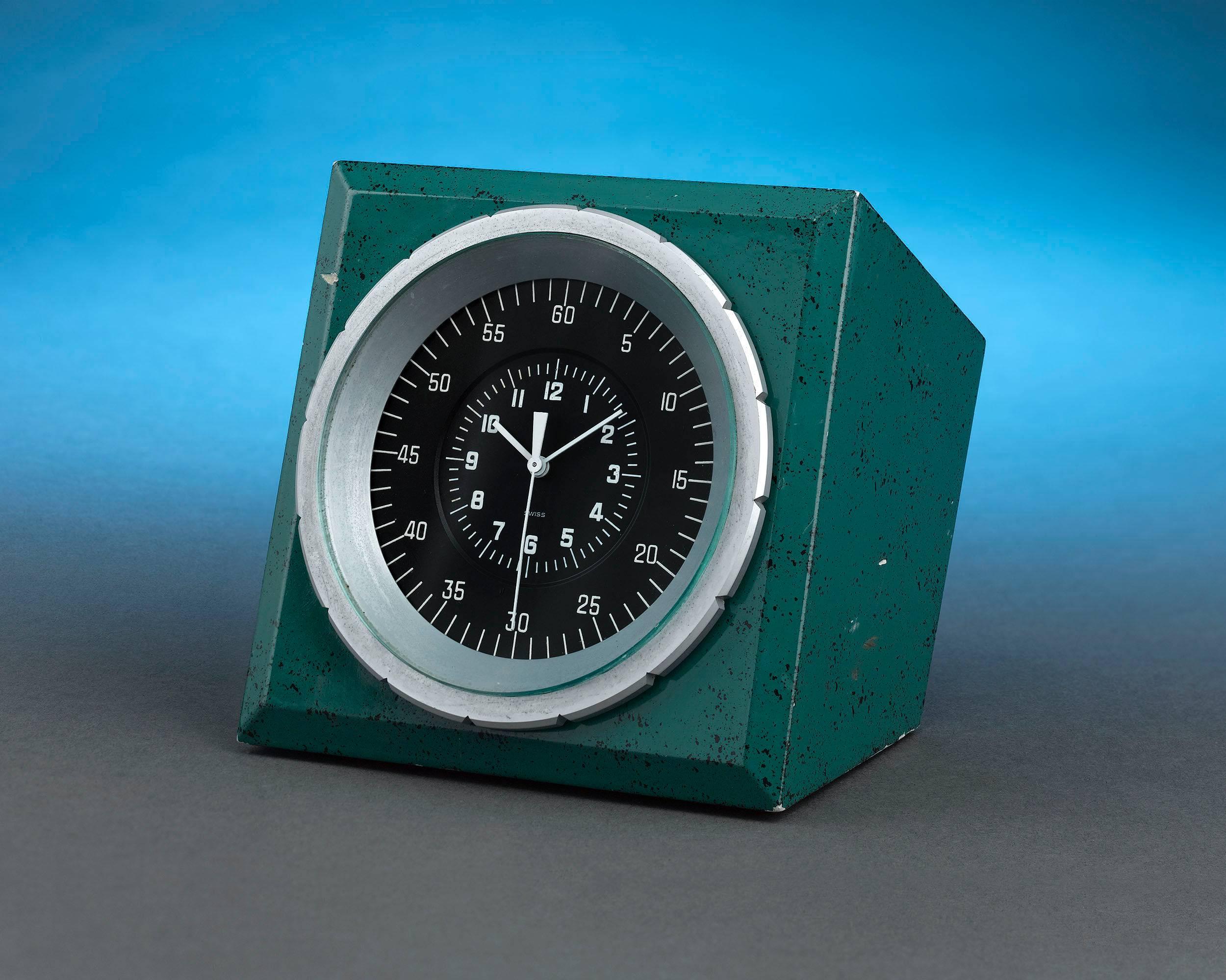 Patek Philippe created this rare Chronoquartz electronic table clock for Rolex. Accentuated in Rolex's iconic green hue, this analog display unit would have been connected to a master clock system to provide its owner with the most accurate time