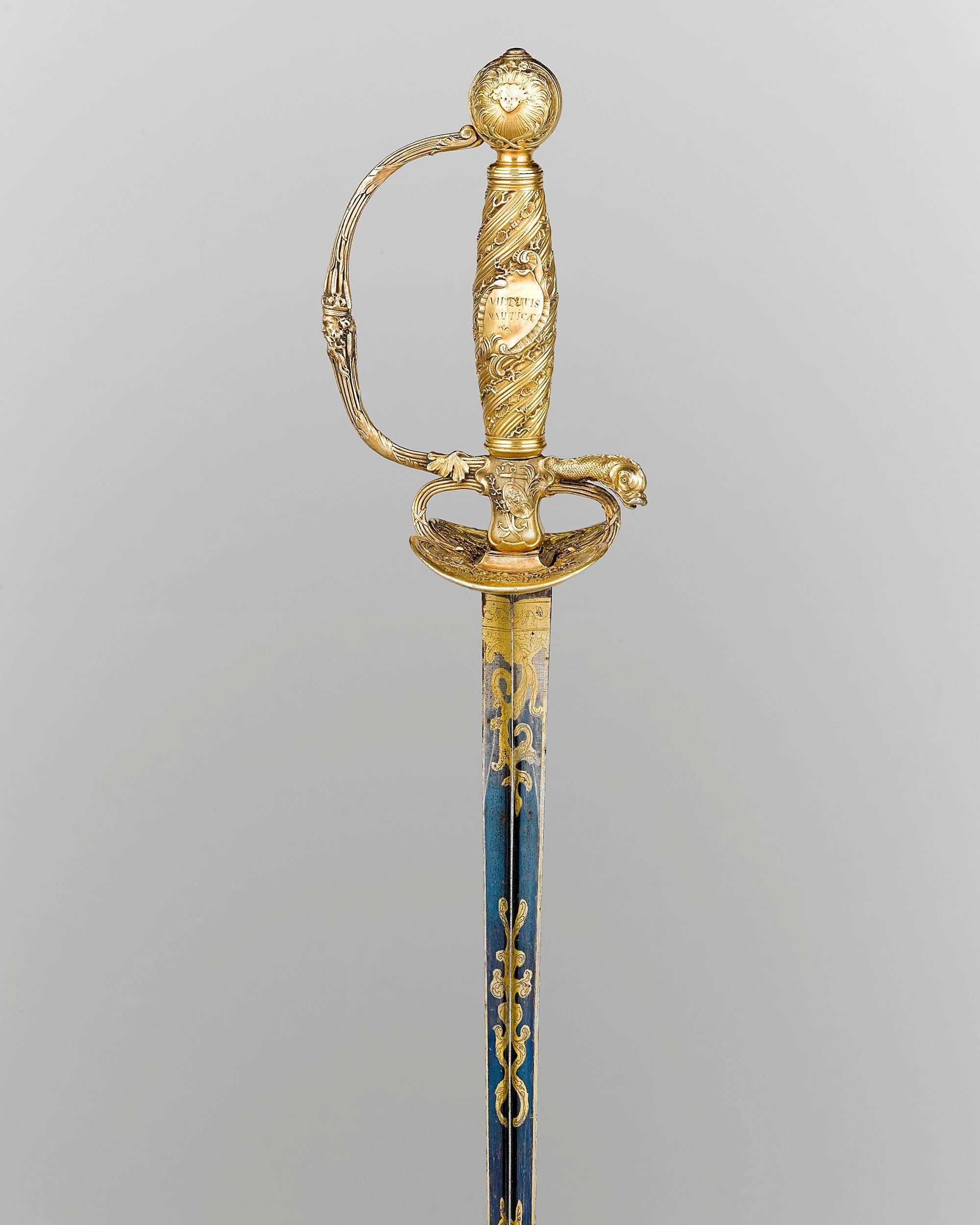 This remarkably rare silver gilt presentation sword was a personal gift from Louis XV, King of France, to the Captain of the Corsairs, Alain Porée. Adorned by a myriad of gilt marine motifs, it is one of two Royal swords presented by the French