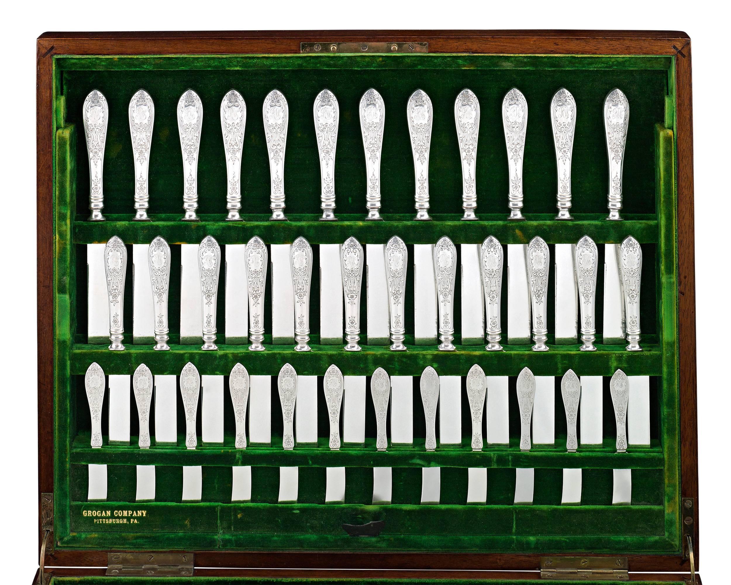 This rare 167-piece Wentworth sterling silver flatware service was crafted by the celebrated William B. Durgin Silver Company. Each piece bears an intricate, hand-chased pattern featuring florettes, acanthus leaves, scrolls, and an open cartouche