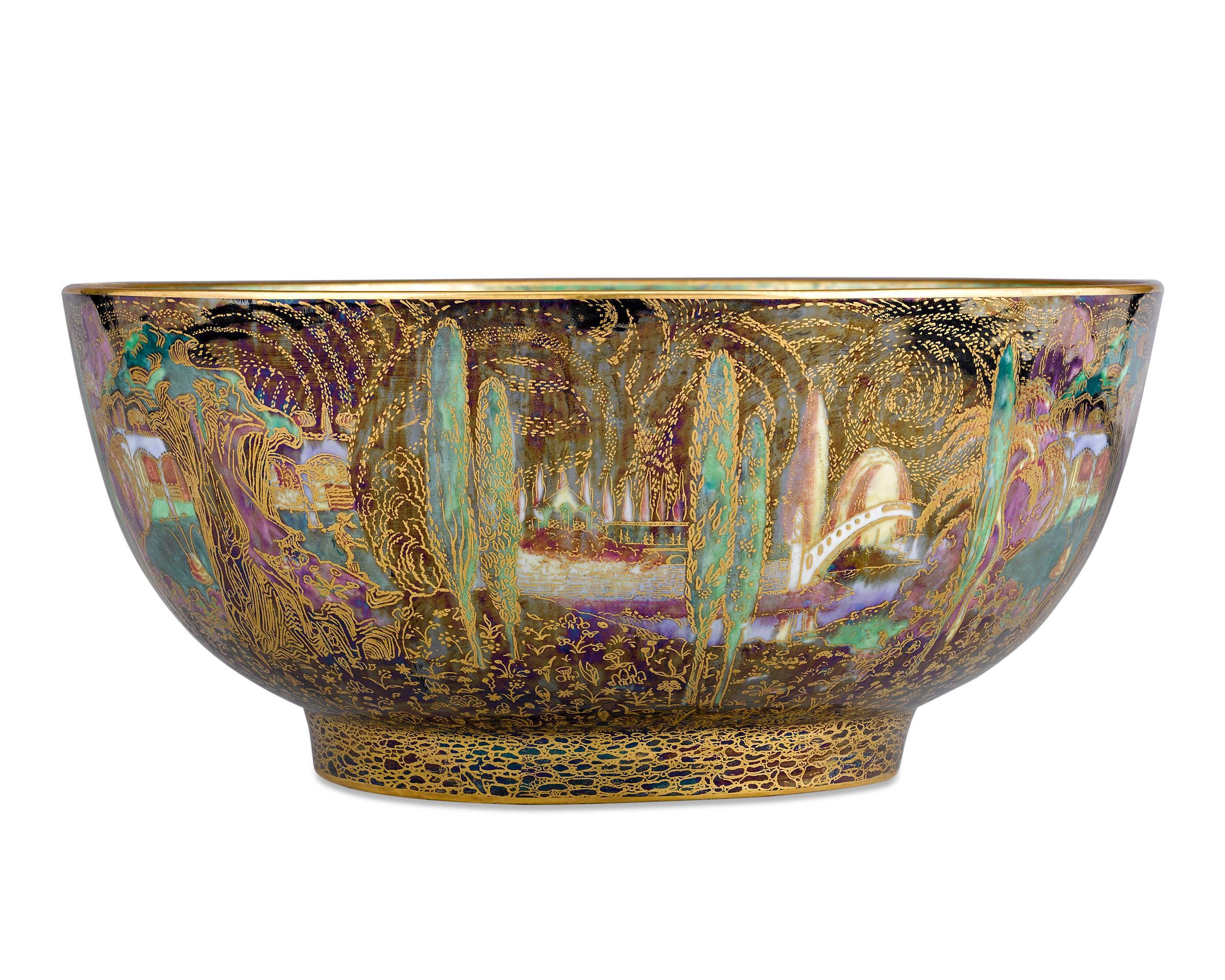 This whimsical Wedgwood Fairyland Lustre bowl designed by Daisy Makeig-Jones displays the fantastical Poplar Trees pattern, the first pattern produced under the title of Fairyland. The bowl's interior is equally fascinating, with the Woodland Bridge