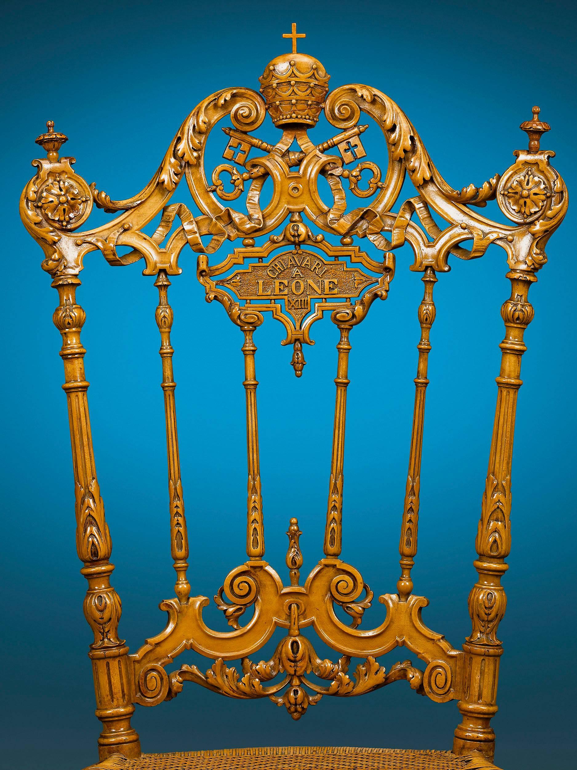 This extraordinary pair of Italian lemonwood chairs boasts a remarkable history. The rare and important set was given to Pope Leo XIII by the Italian City of Chiavari, a city that is renowned for their incredibly unique furniture design, including
