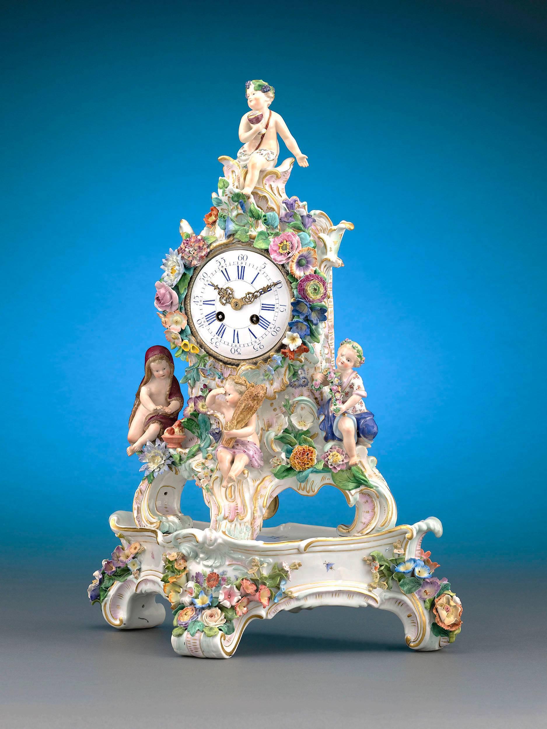 This ornate Meissen porcelain mantel pendulum clock showcases the company's mastery of allegorical themes with its striking depiction of the Four Seasons. Winter is enveloped in a warm cloak, fall holds a sheath of wheat, spring embraces a floral