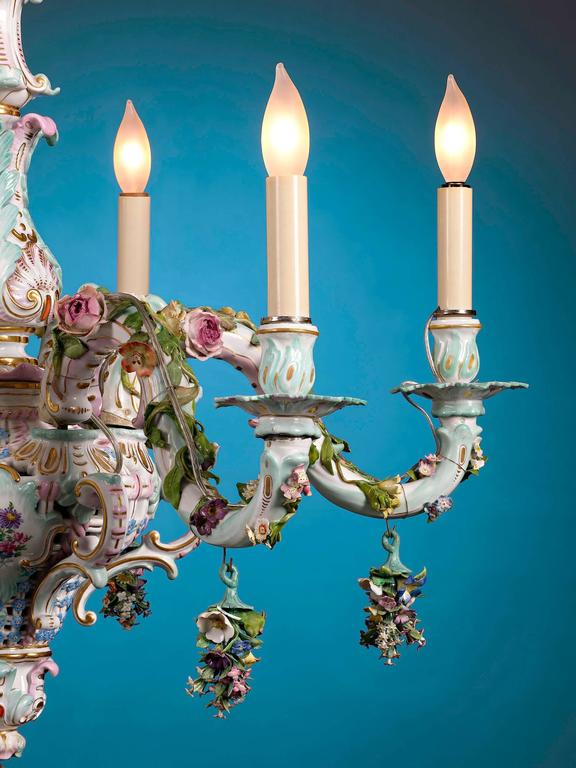 This magnificent porcelain chandelier, crafted by the renowned Meissen manufactory, is a marvelous example of that renowned firm's exceptional artistry. This enchanting six-armed light exemplifies the Rococo style. Its lush garden motif calls to