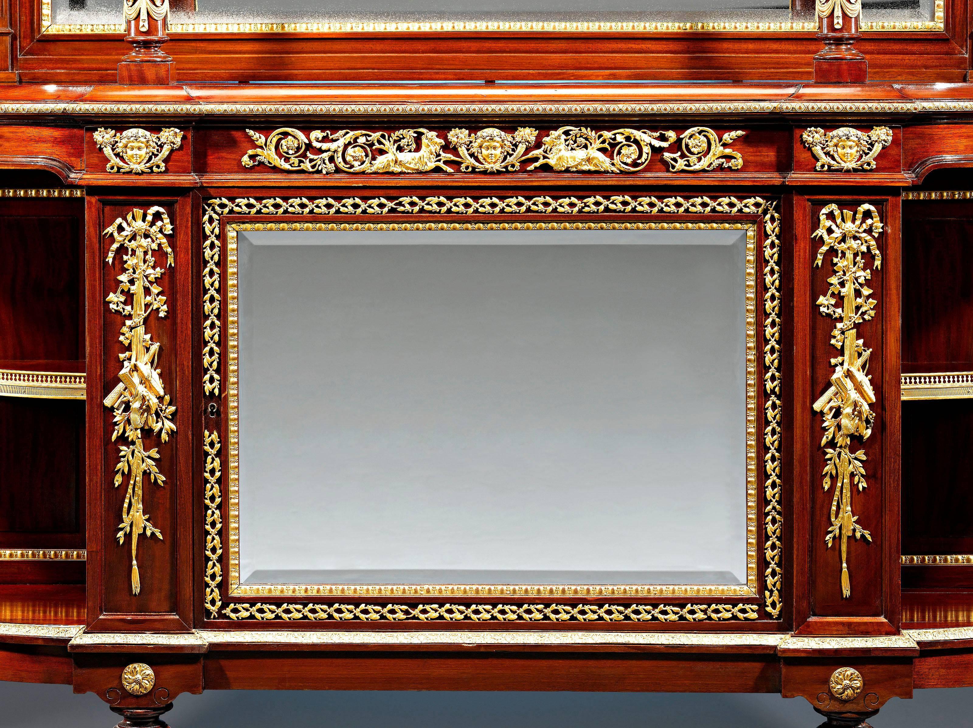 A splendid French Louis XVI style mahogany sideboard lavishly adorned with doré bronze mounts of the highest craftsmanship. Pierced doré bronze galleries complete the look of this exceptional work. Excellent condition,

circa 1870.