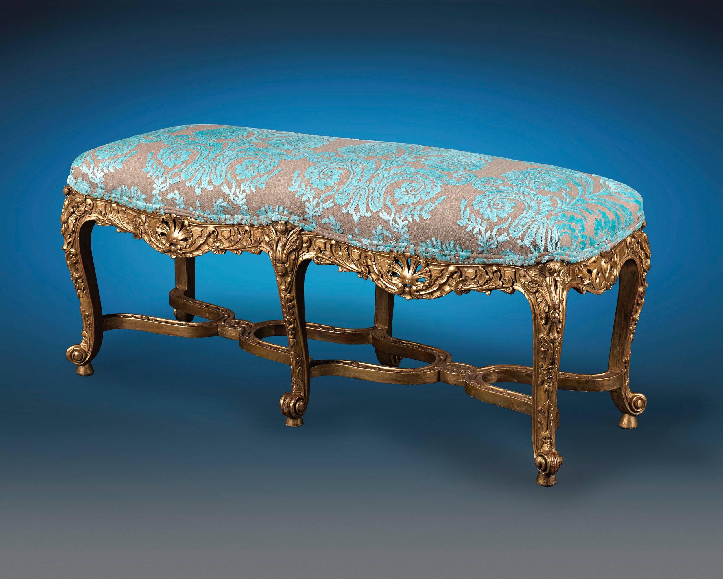 A remarkably rare specimen of Italian craftsmanship, this 18th century giltwood stool showcases exquisite elements of Louis XV design. By the Mid-Century, the powerful influence of French styles permeated the works of Italian cabinetmakers, who