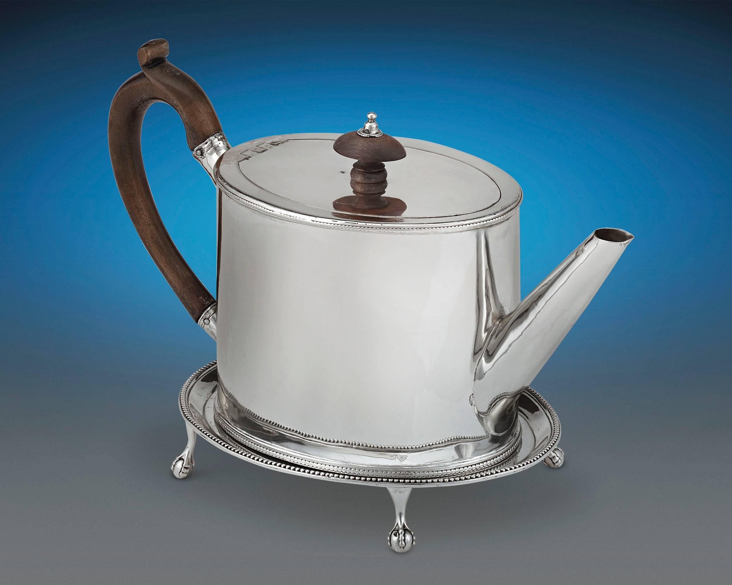 Refined specimens of Georgian sophistication, this beautiful Georgian silver teapot and waiter set was crafted by Hester Bateman, the famed English female silversmith. Each piece reflects the legendary smith's uncanny eye for elegance, with her