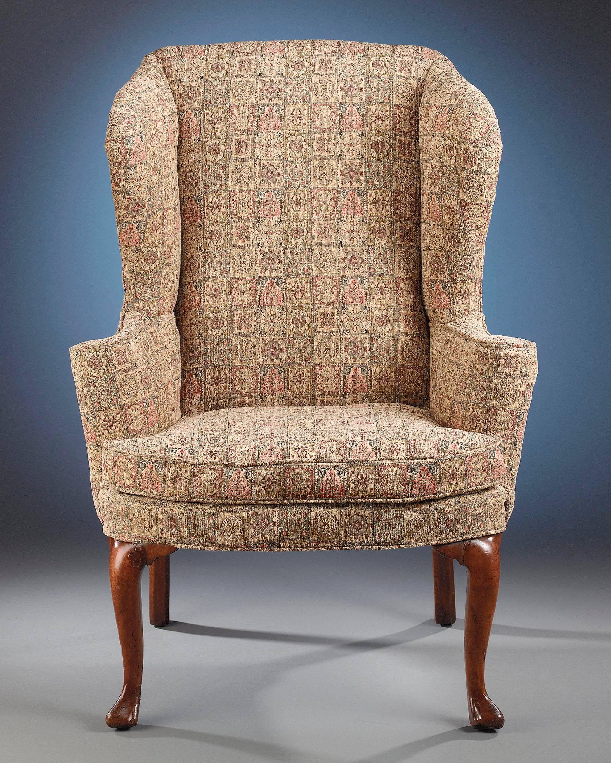The wingback chair was designed to provide the ultimate in comfort while maintaining aesthetic appeal. Beautifully proportioned, this Irish mahogany chair emphasizes elegance and simplicity. The chair's fine cabriole legs and trifid feet make it a