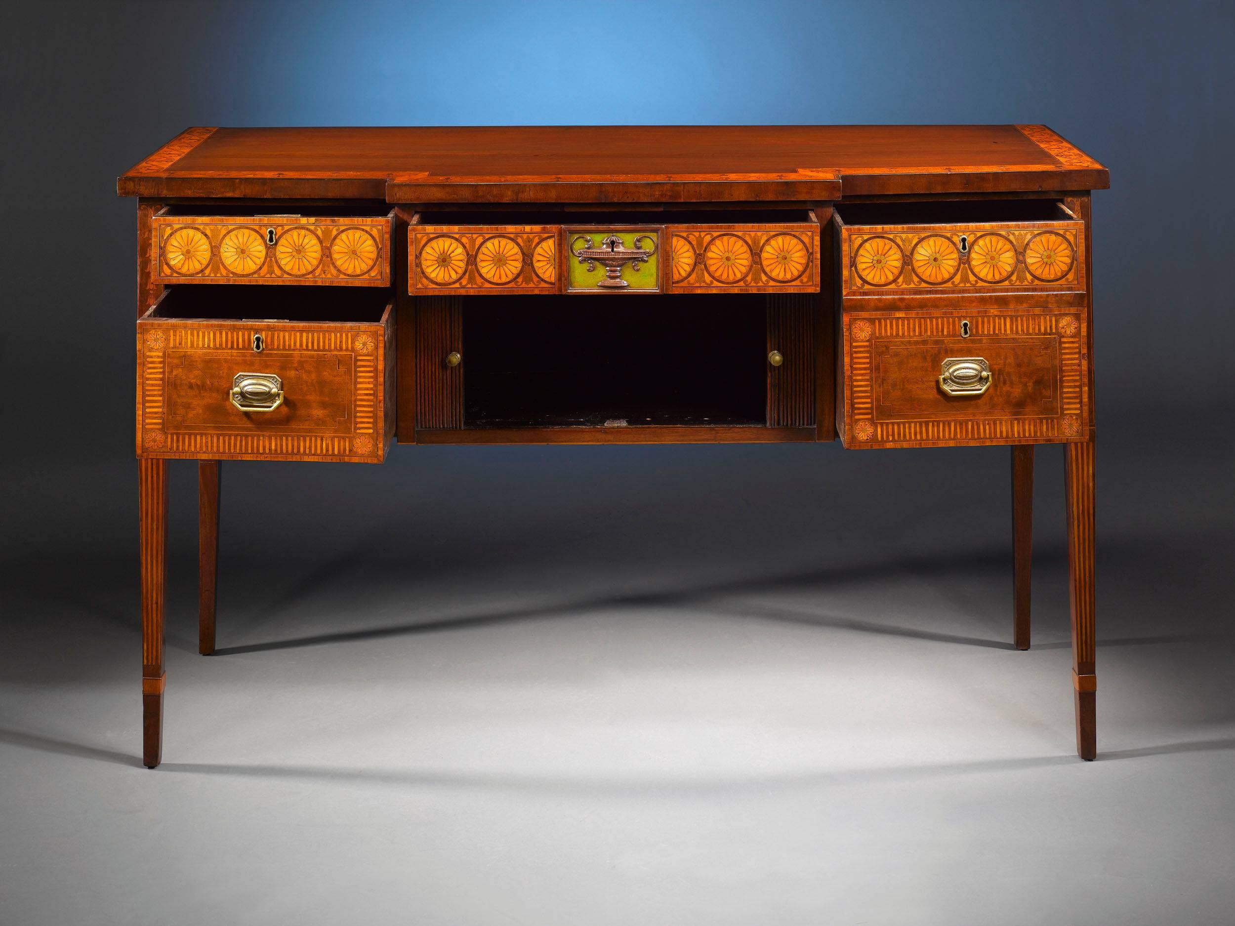 A rare and highly important, 18th century mahogany sideboard, exhibiting all the finest elements of the renowned Hepplewhite style. Exceptional marquetry inlay work of pateras and scrolls in satinwoods, rosewoods and incredibly rare green-dyed woods